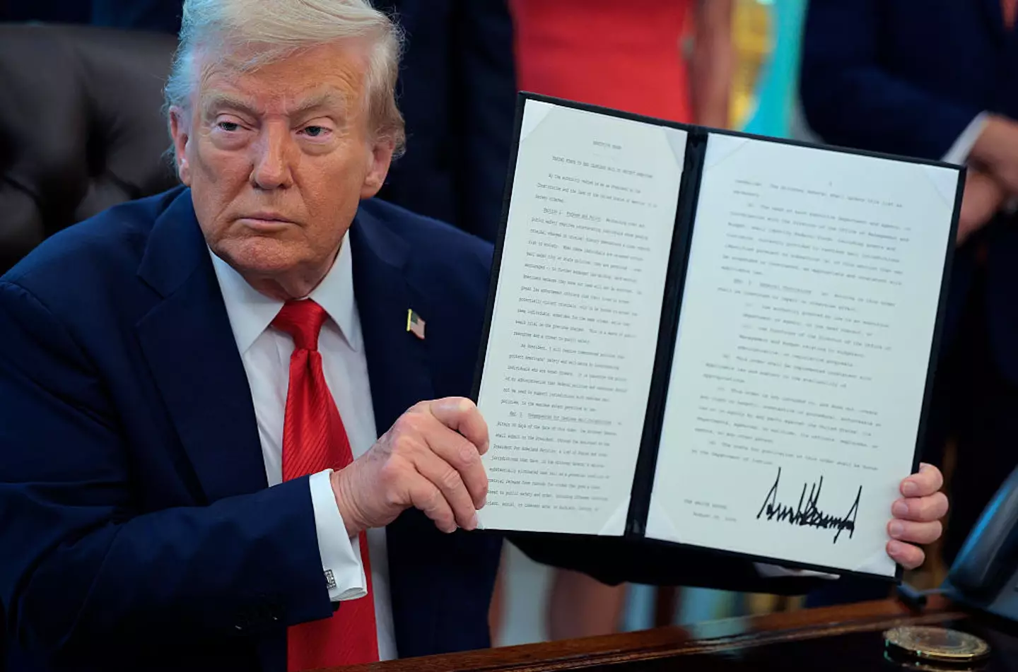 Trump signed the order and said burning the flag would be made a criminal offense (Chip Somodevilla/Getty Images)