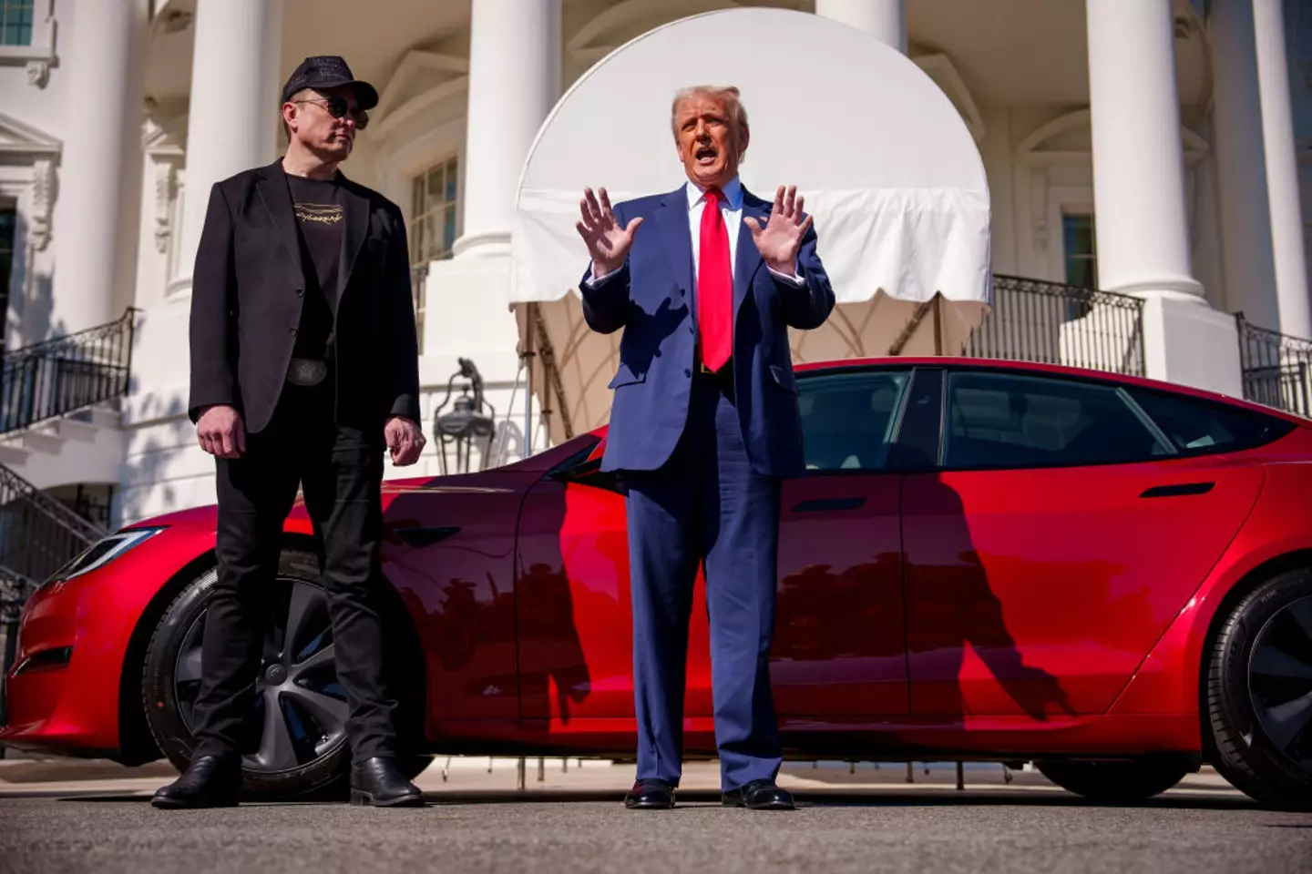 Despite the president recently purchasing a Tesla in support of his buddy, Musk, the company says it could be harmed by retaliatory tariffs (Andrew Harnik/Getty Images)