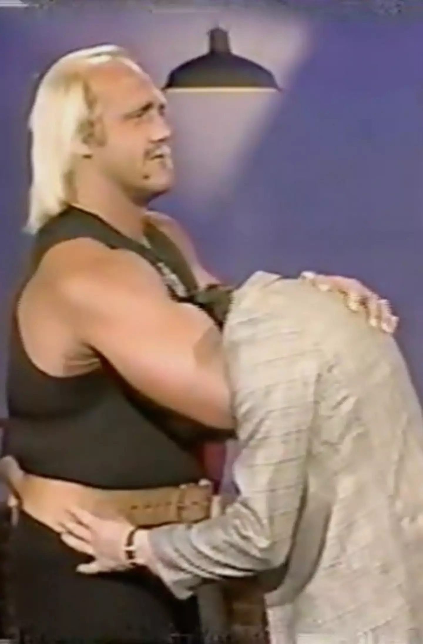 The host decided to challenge Hogan to a wrestling move.