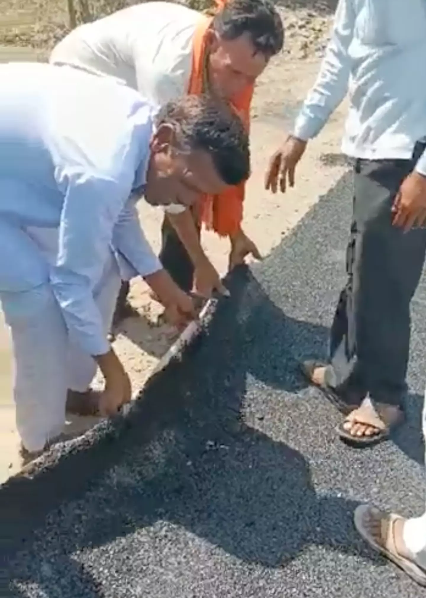 The residents exposed the cracks under the road.
