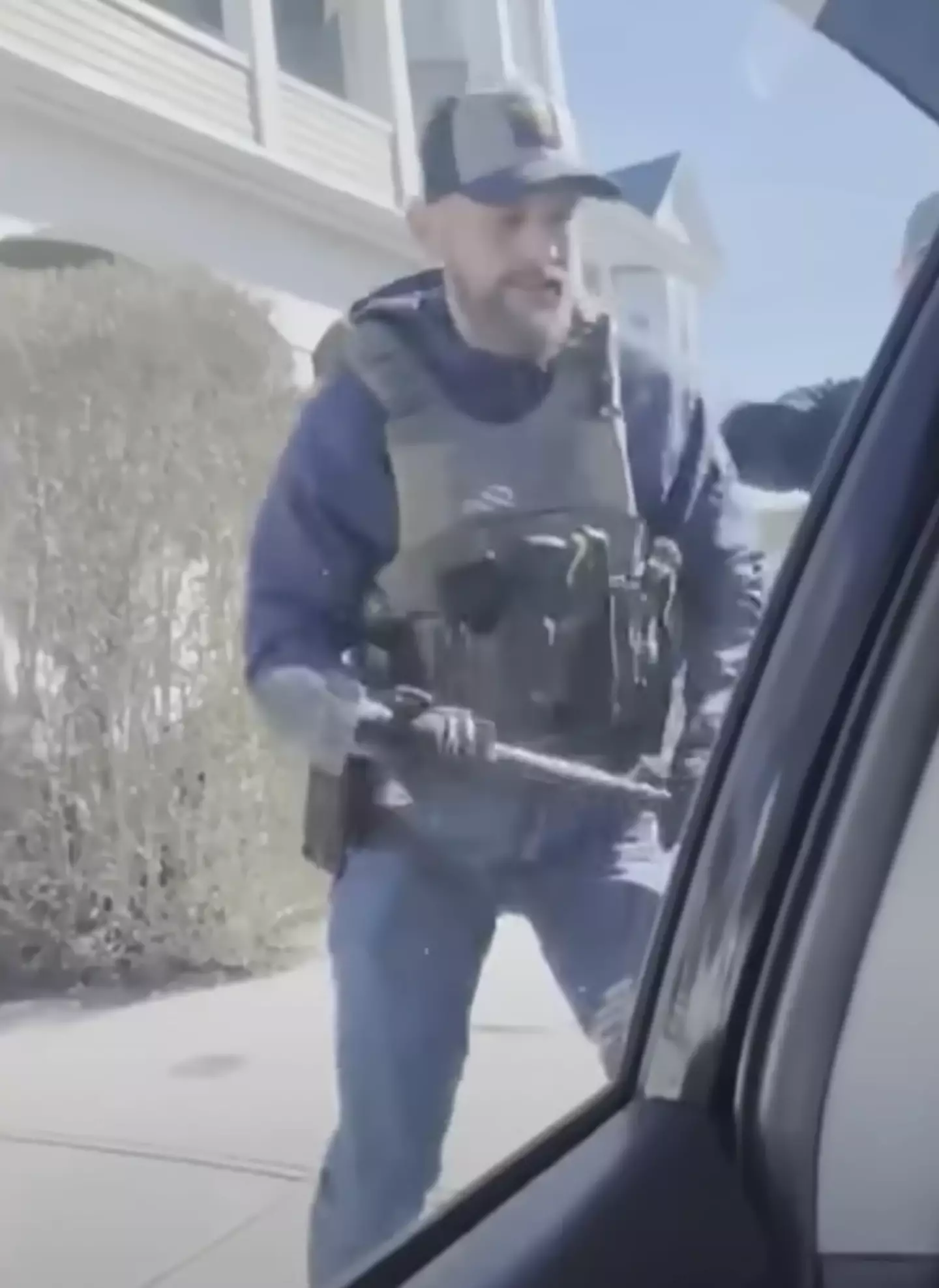 An ICE officer used a hammer to smash the car window (NBC10 Boston)