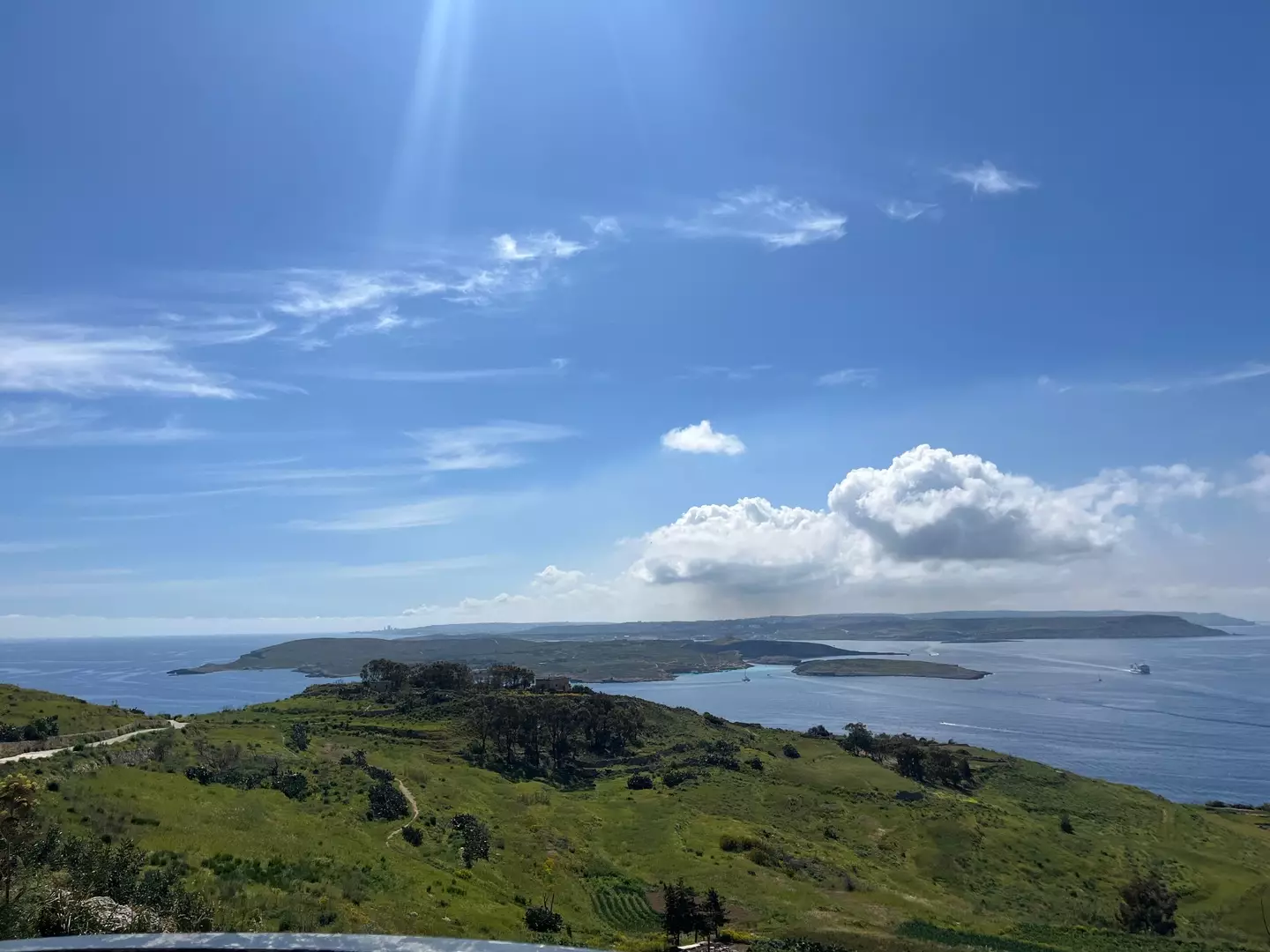A view of mainland Malta in the distance, with the island of Comino serving as a buffer between Malta and Gozo - where the snap was taken (LADbible)