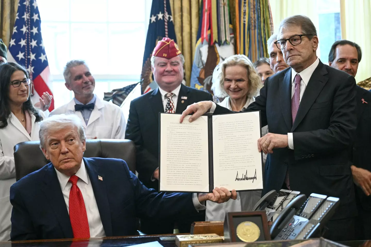 Trump signed the executive order calling for weed to be treated as a less dangerous drug (Brendan SMIALOWSKI / AFP via Getty Images)