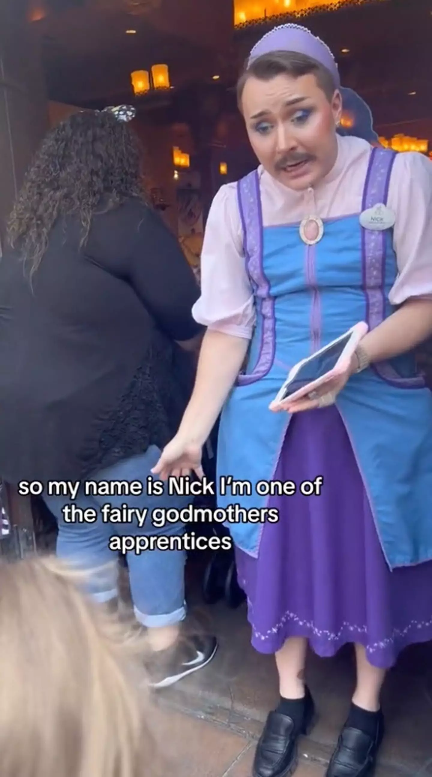 People are defending the appearance of Nick the Fairy Godmother at Disneyland.