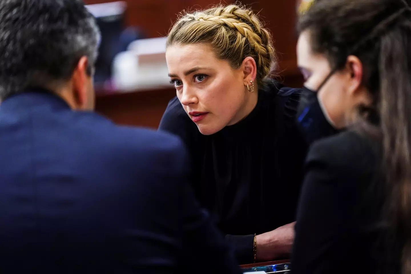 Eva Barlow - a supporter of Amber Heard - was caught using her phone in the courtroom in breach of a court order.
