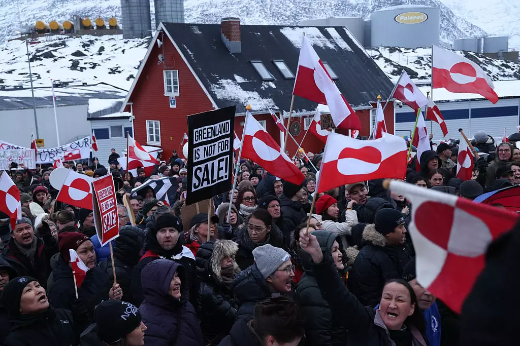 Protesters took to the icy streets of Greenland over the weekend to say their island is 'not for sale' (Sean Gallup/Getty Images)