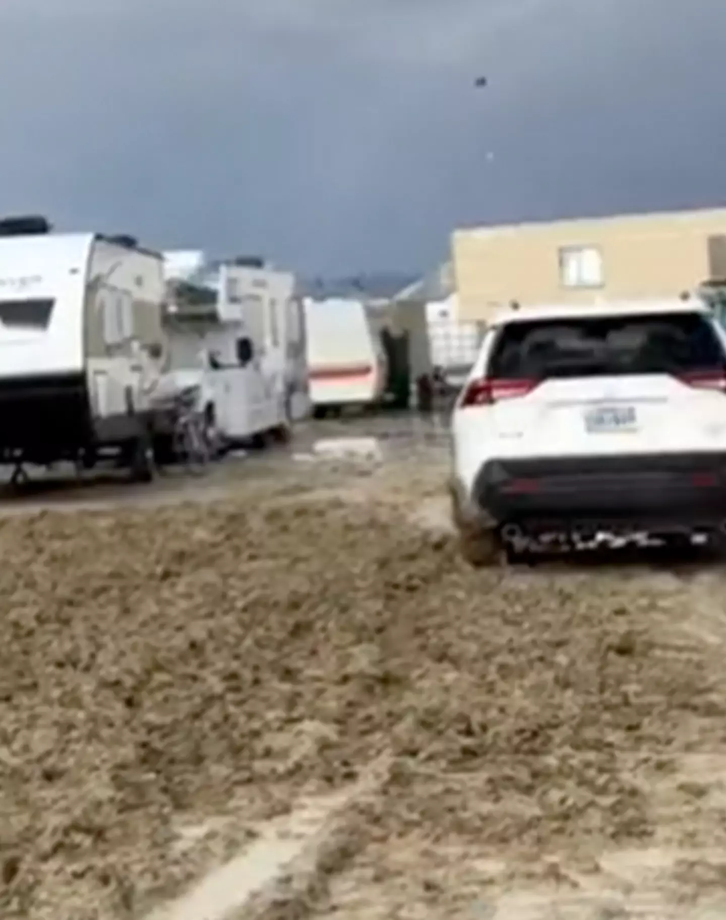 Torrential rain has turned Burning Man festival into a total mud bath.