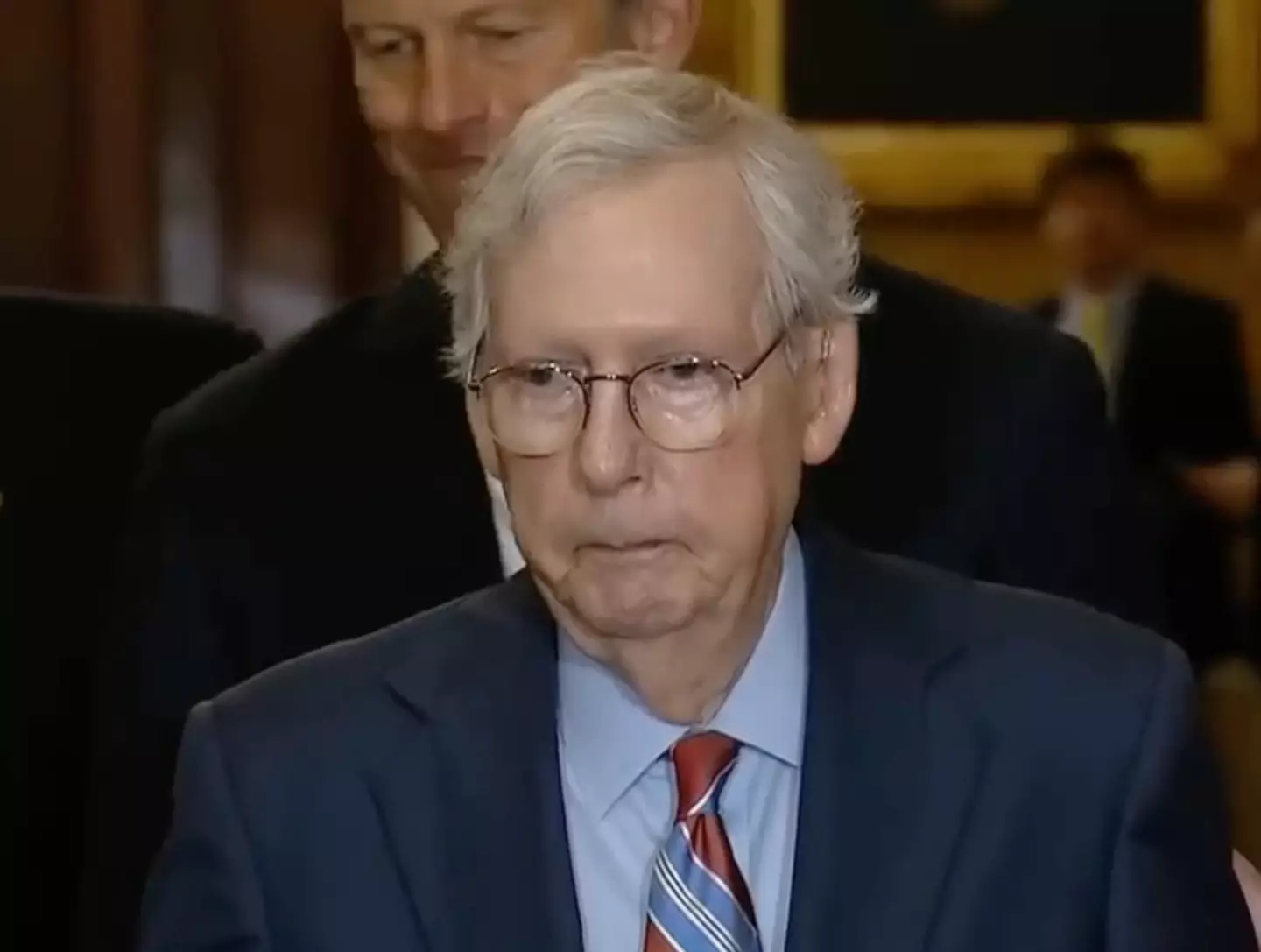 Mitch McConnell was led away after he 'froze'.