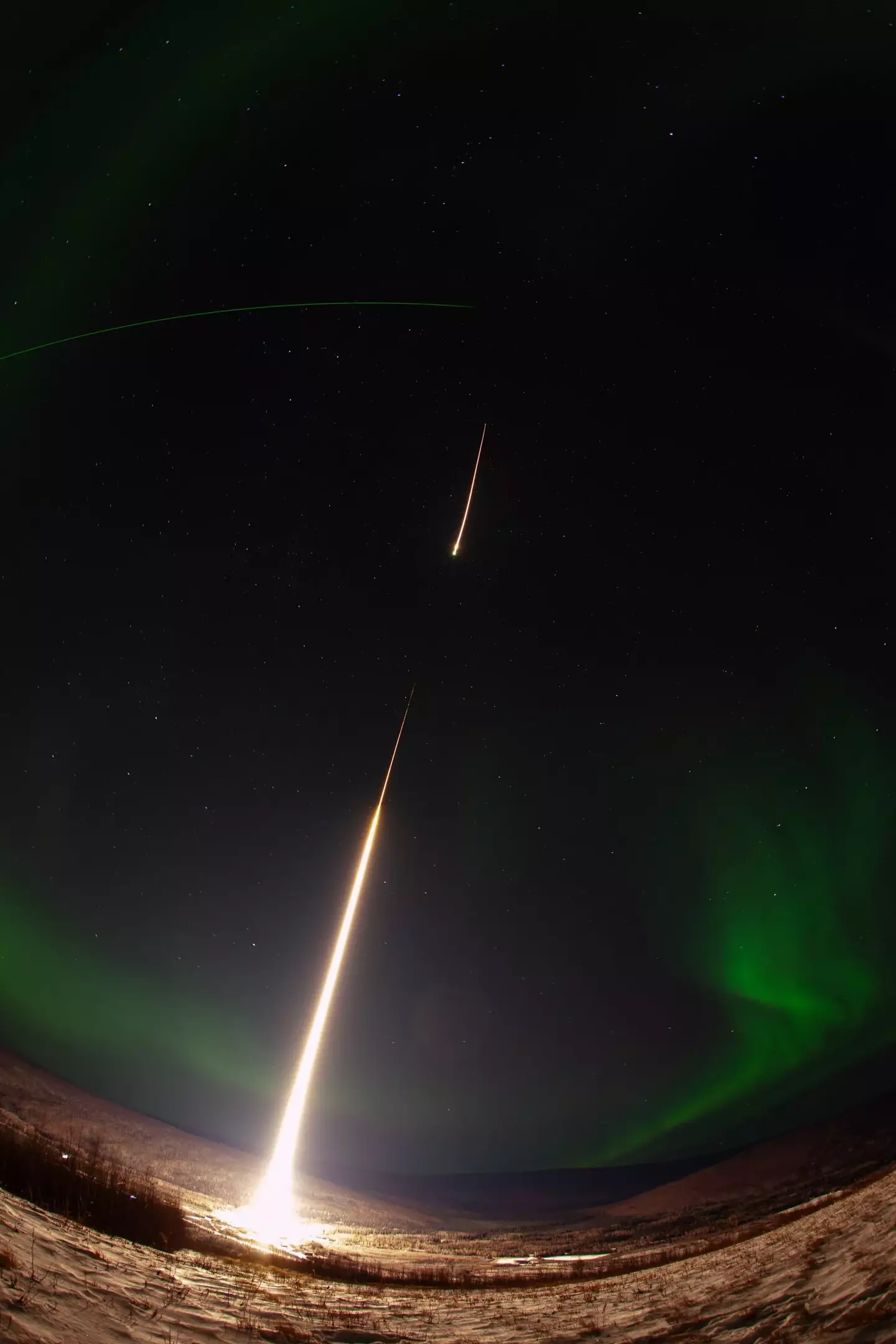 The viral video shows the beautiful green hue of the aurora borealis interrupted by the rocket launch.