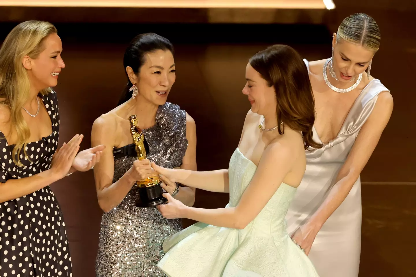 Emma Stone collects the award.