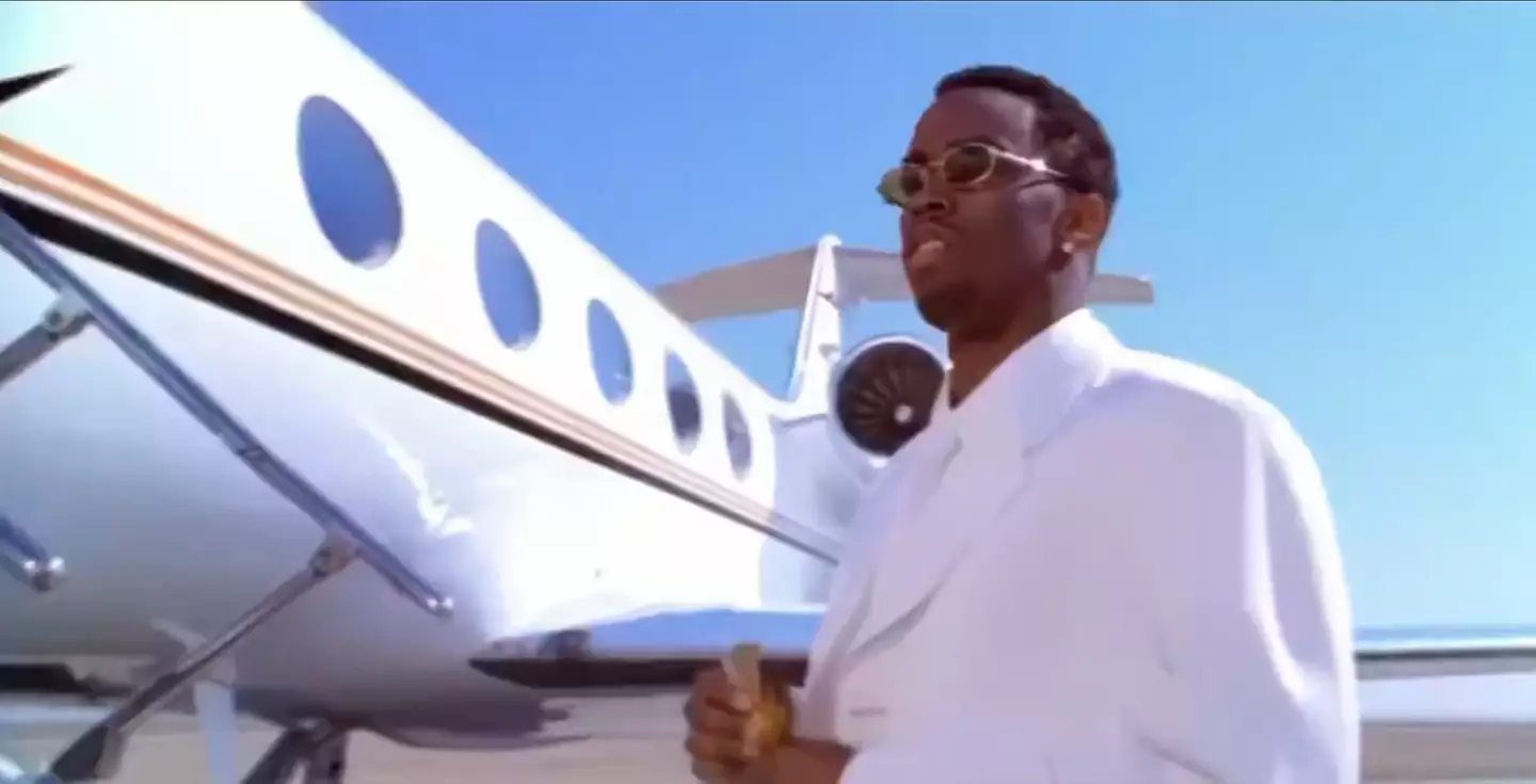 The clip shows Combs standing outside a private jet on the runway.