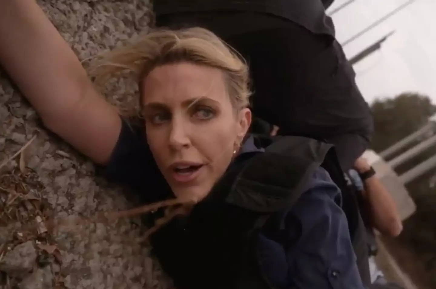 The reporter was forced to take cover in a ditch while live on TV.