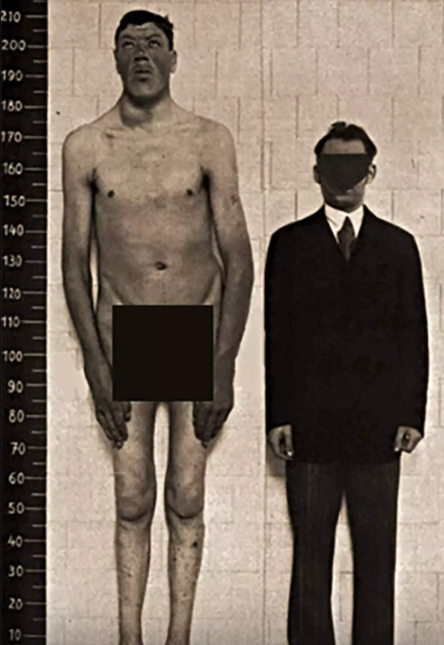 Rainer after his growth spurt next to an average-sized man.