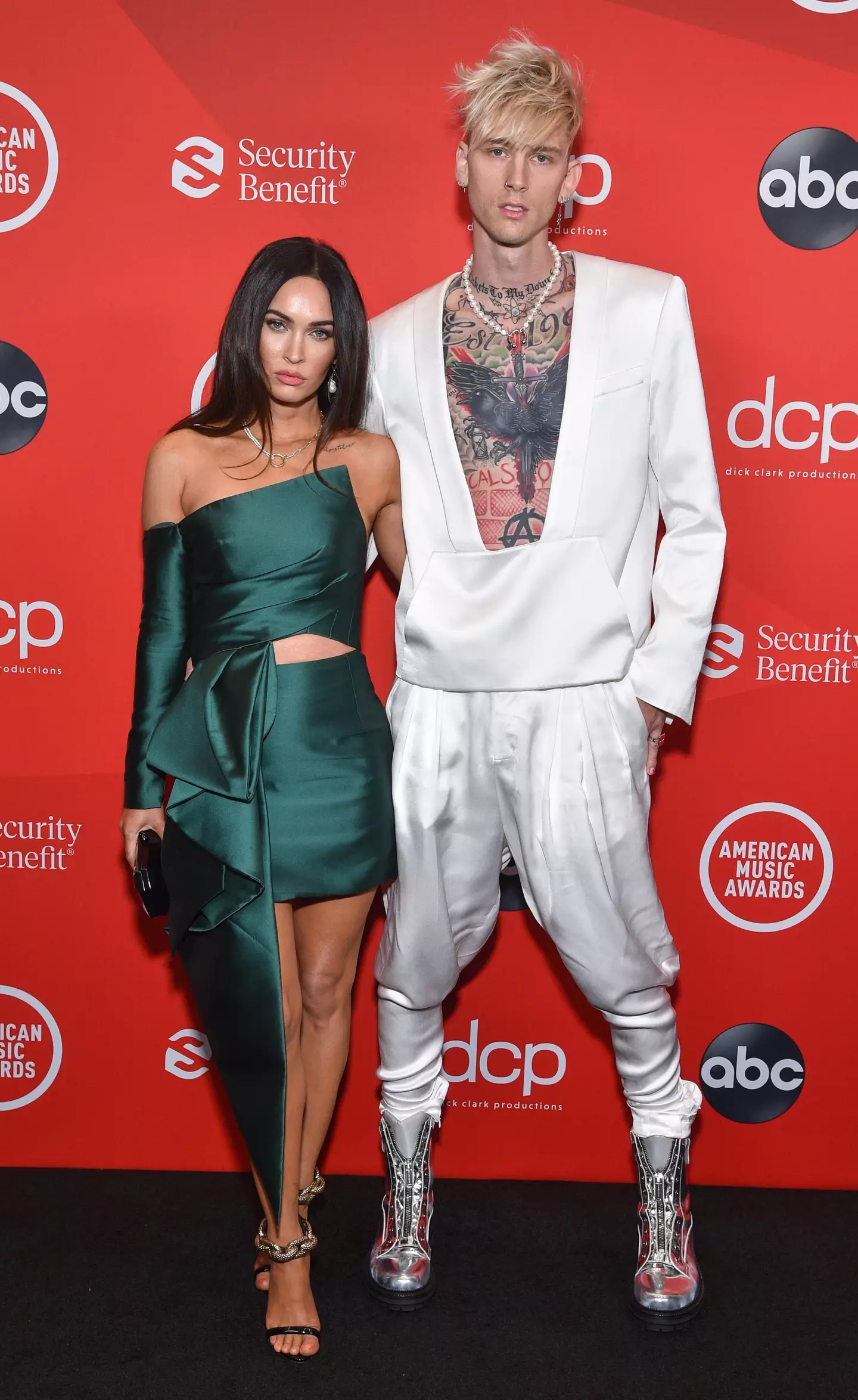 Machine Gun Kelly with Megan Fox and all his tattoos.