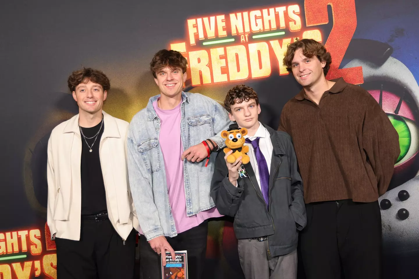 Tucker, Connor, and Carson with little brother Hudson attended a premier together on December 2 (Savion Washington/Getty Images for Universal Pictures and Blumhouse)