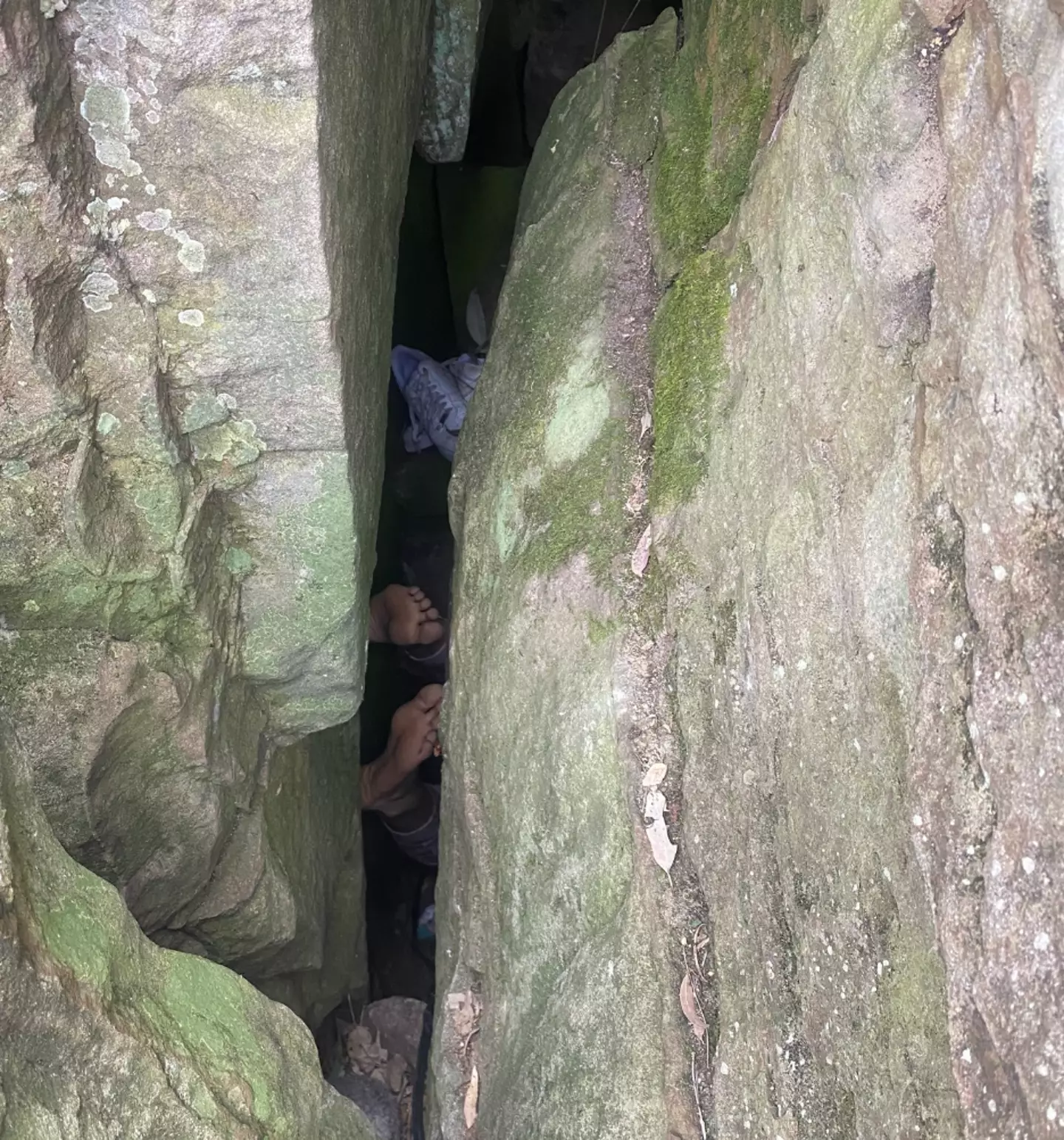 The woman's feet stick out as she remains trapped (NSW Emergency)