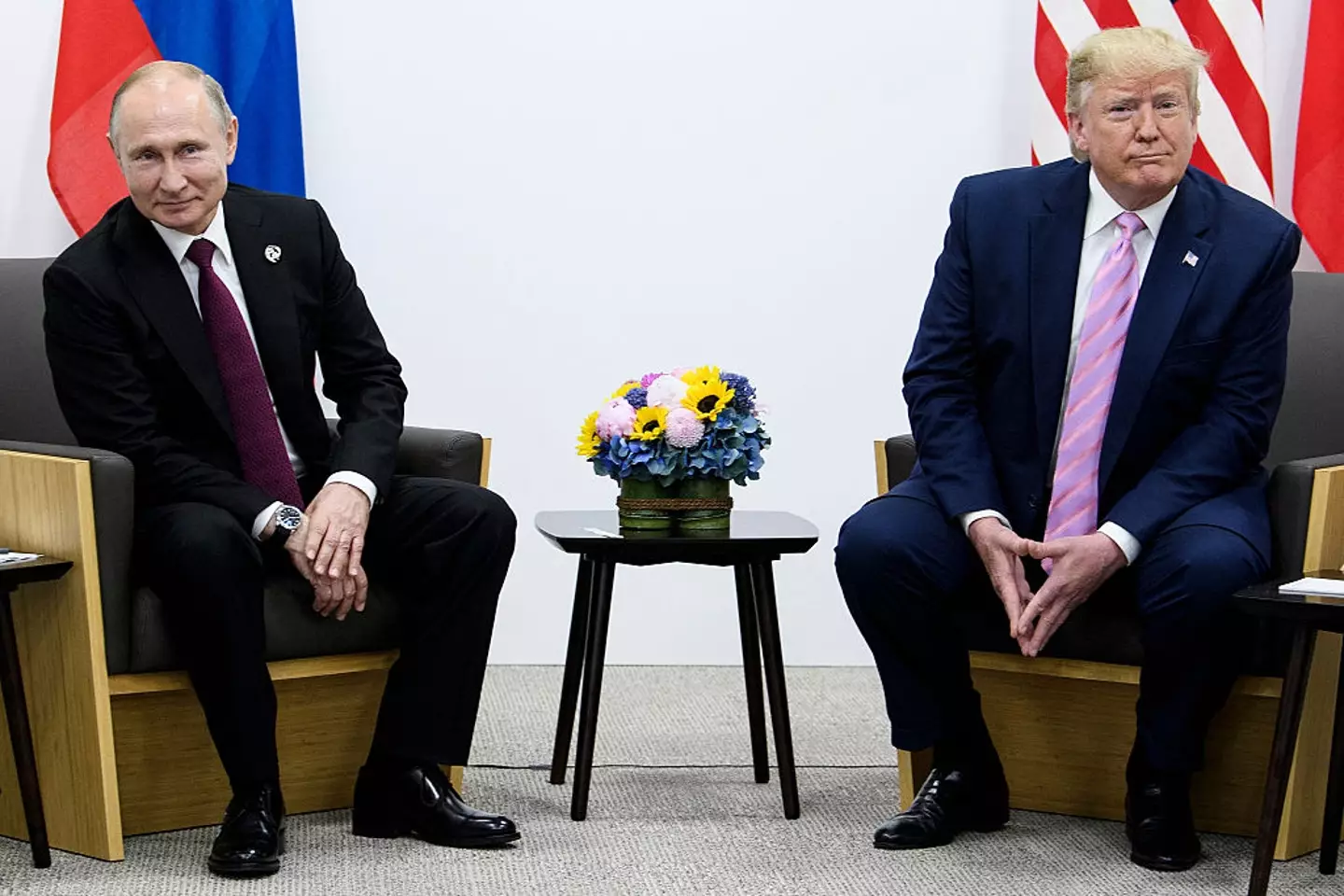 Vladimir Putin and Donald Trump will sit down together on Friday (BRENDAN SMIALOWSKI/AFP via Getty Images)