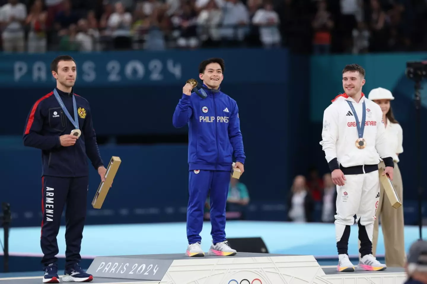 Gold medalist Carlos Yulo tops the podium for the Men's Vault event. (Sheng Jiapeng/China News Service/VCG via Getty Images)