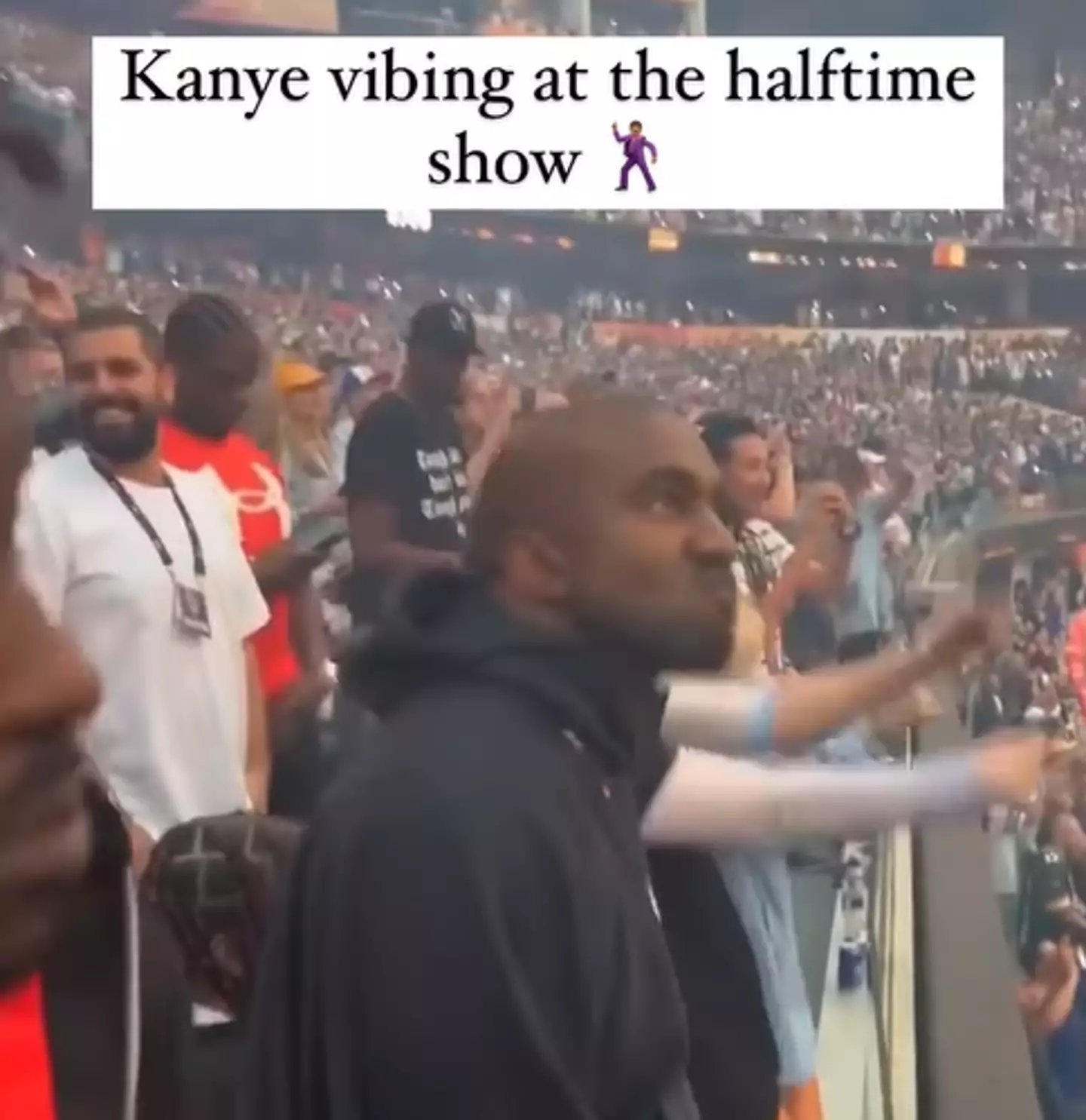 Kanye West seen bopping along to Eminem's Super Bowl Halftime show (@justinlaboy/Instagram)