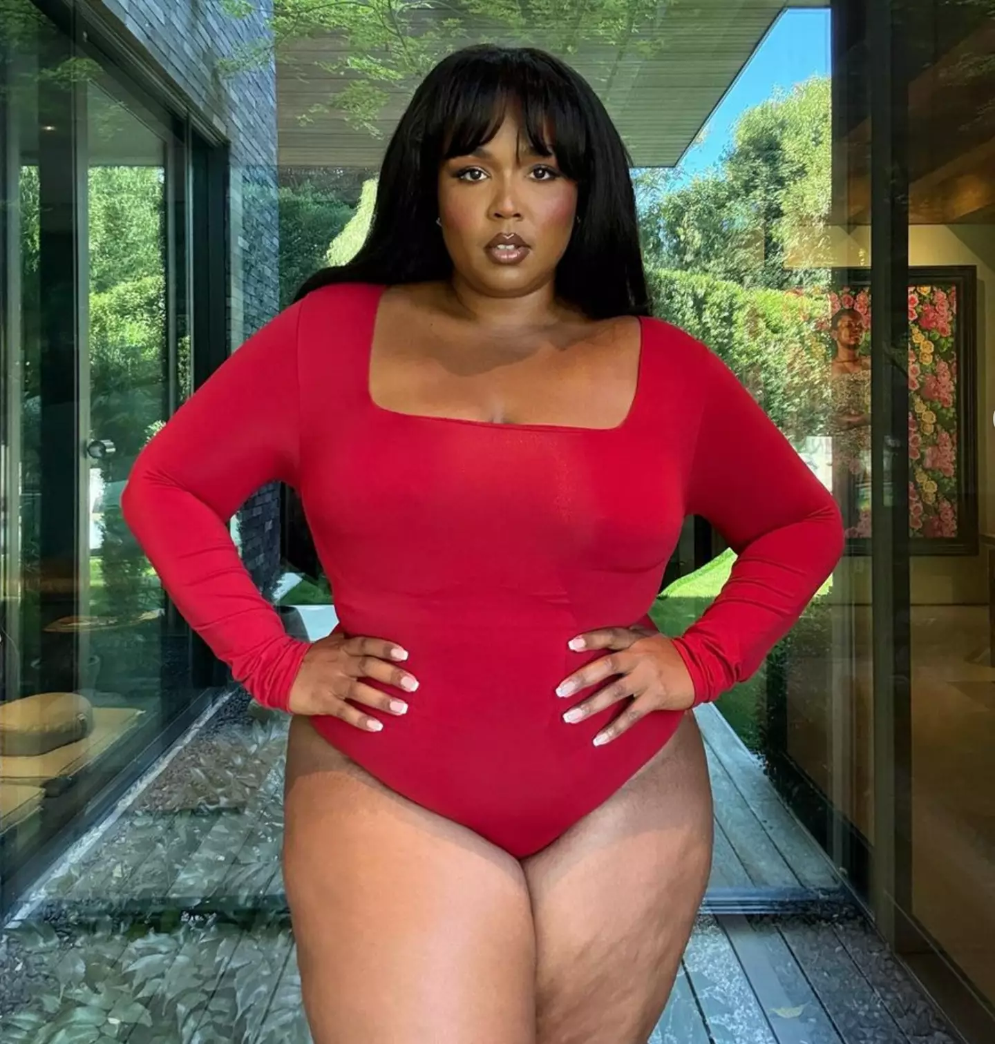 Lizzo seen showing off her physique while wearing Yitty shapewear (lizzobeeating/Instagram)