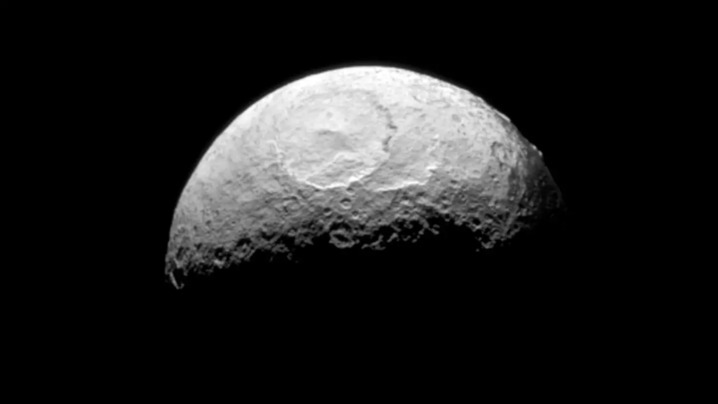 Eerie photo of Saturn’s moon reveals unusual detail that NASA scientists can’t figure out