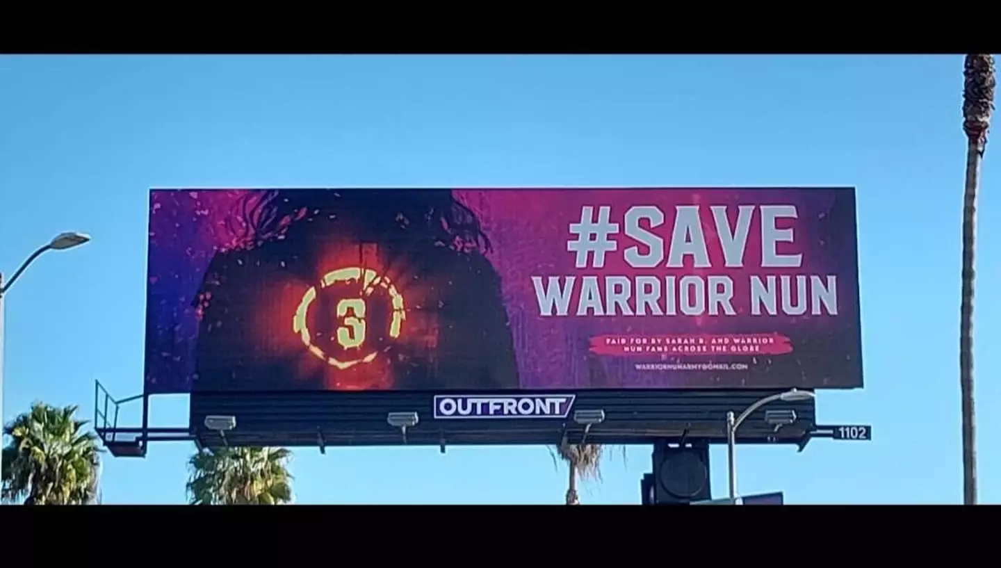 The giant billboard urges Netflix to #SaveWarriorNun.