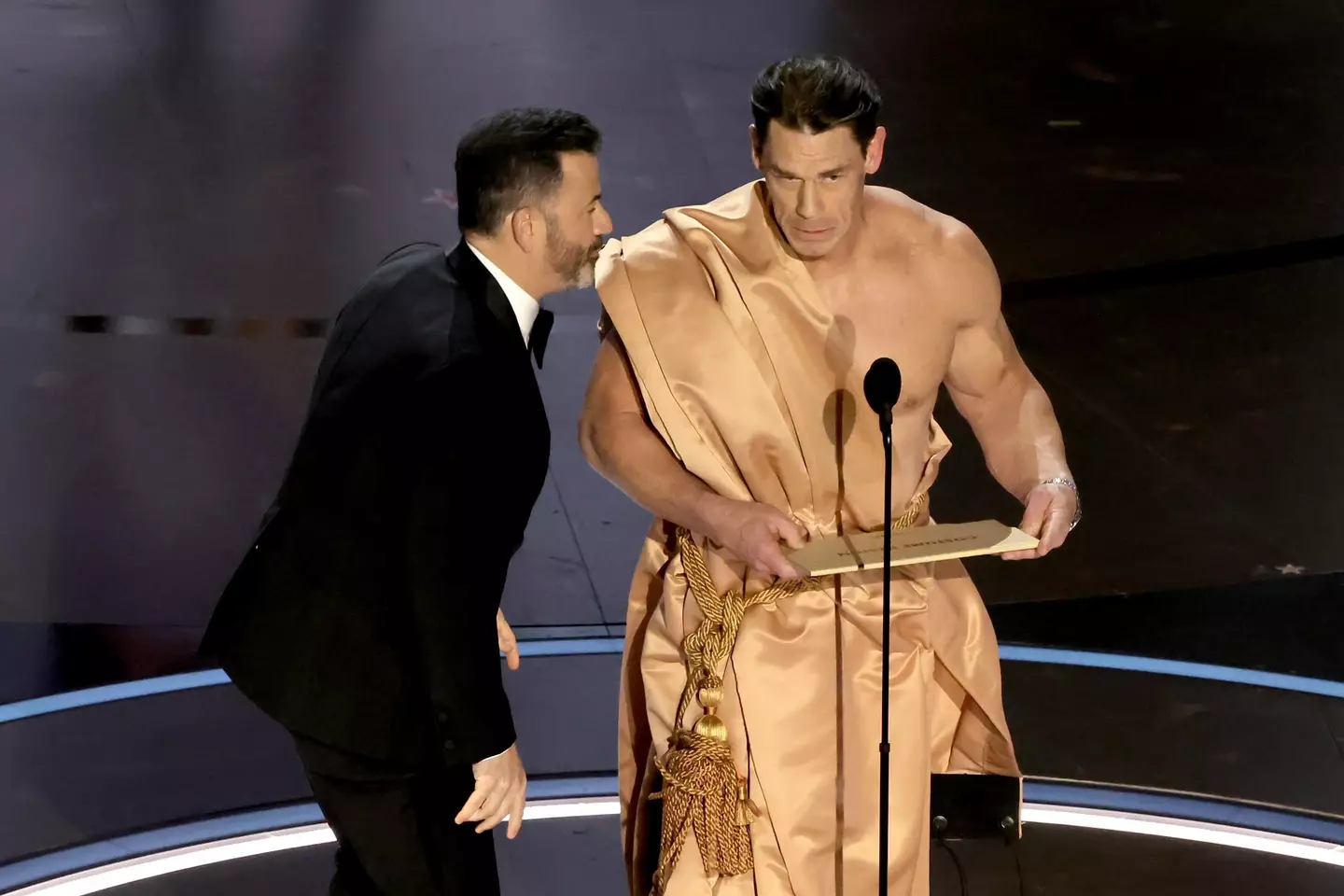 Cena donned a curtain to announce the winner.