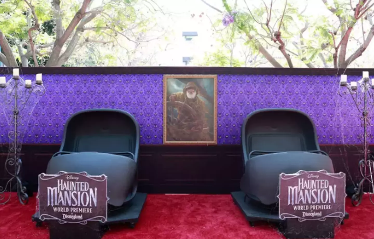 Guests sit in these 'doom buggies' for the ride (MICHAEL TRAN/AFP via Getty Images)