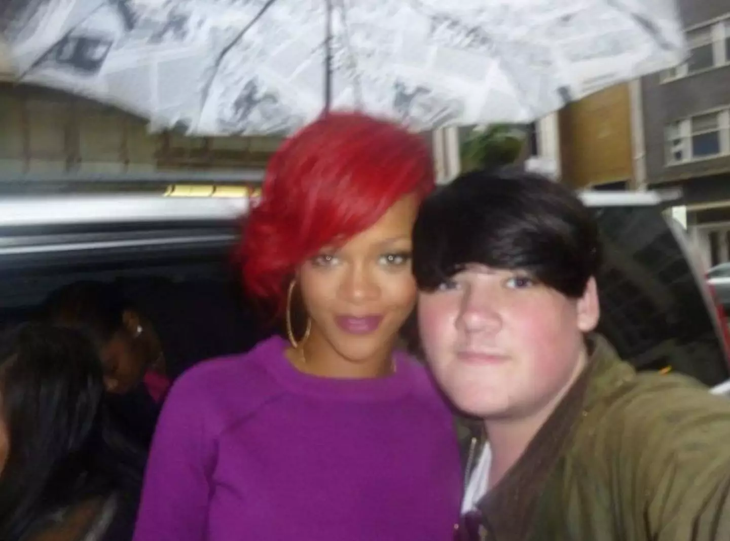 Yes, that's Rihanna under an umbrella.