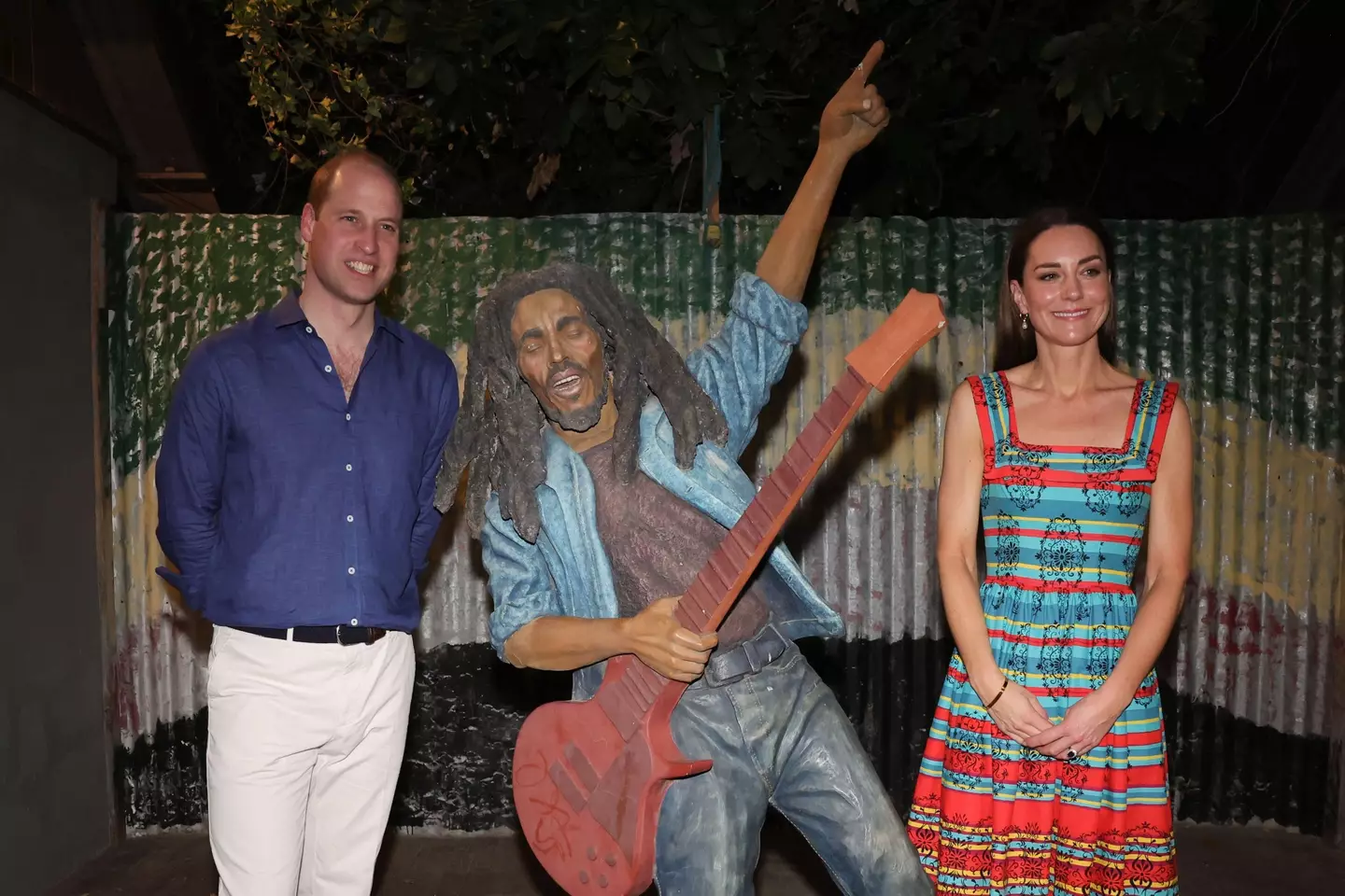 The Duke and Duchess of Cambridge posing next to a cut-out of Bob Marley on their week-long tour in celebration of the Queen's Diamond Jubilee.
