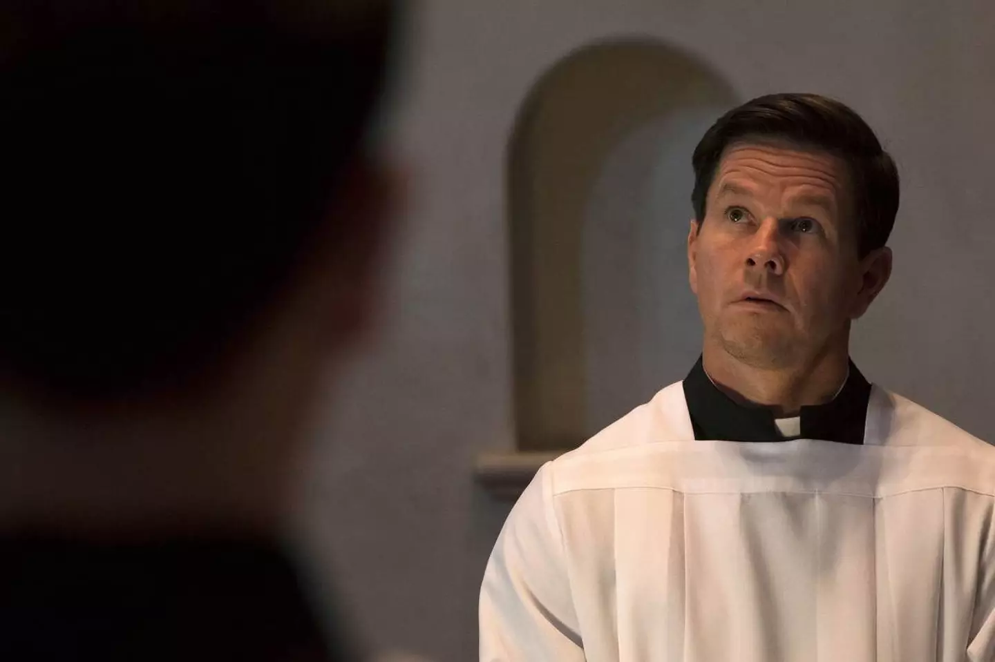 Mark Wahlberg as Father Stu.