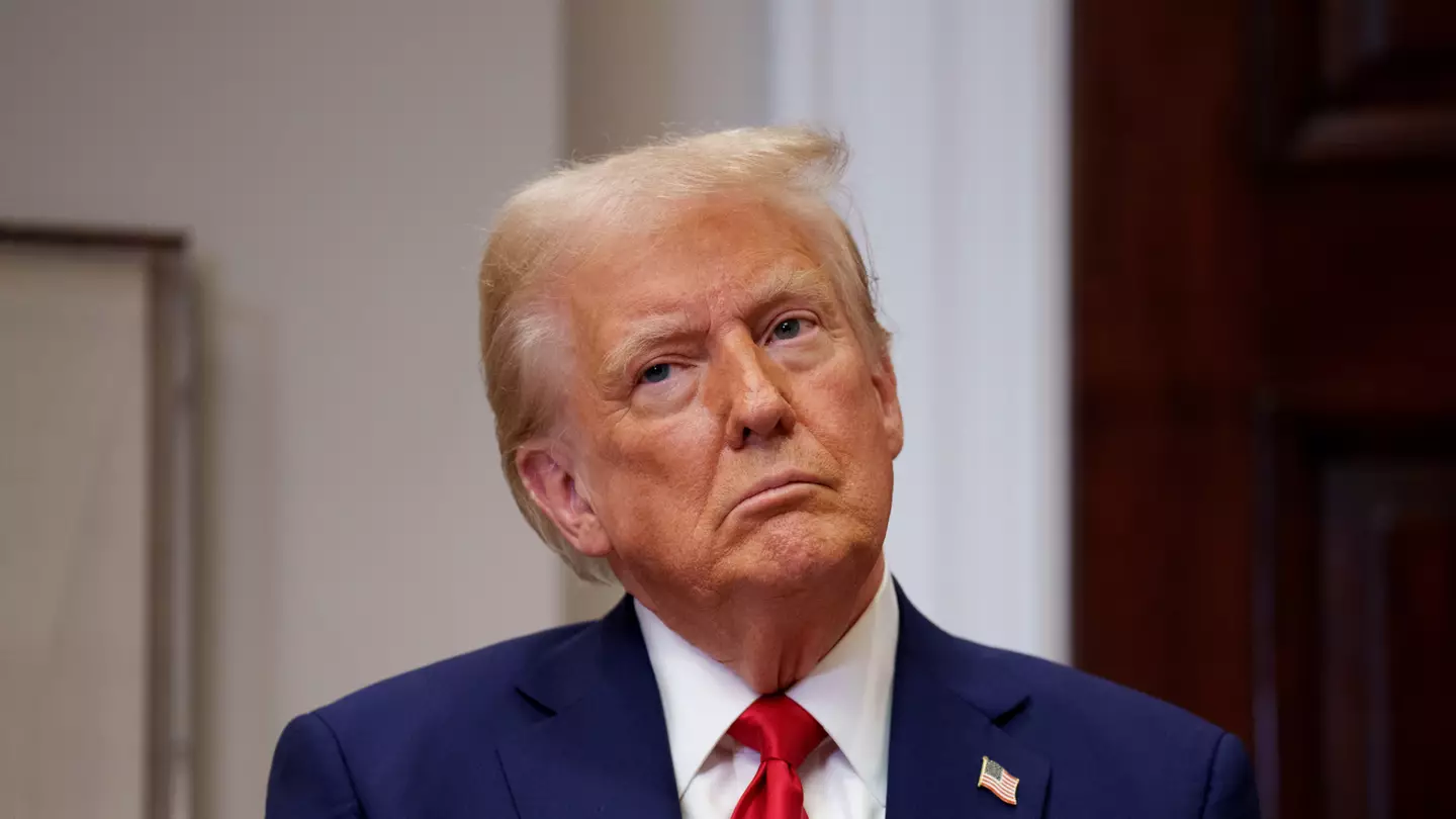 Video of Donald Trump kissing Elon Musk's feet played on TVs inside government building in shocking stunt