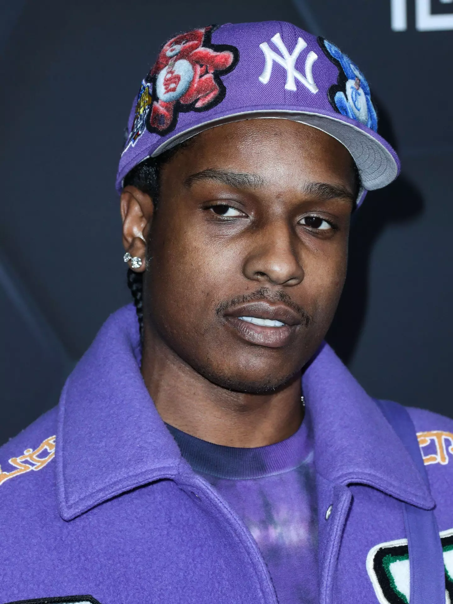 The rapper has been charged over allegedly firing a gun at an old friend.