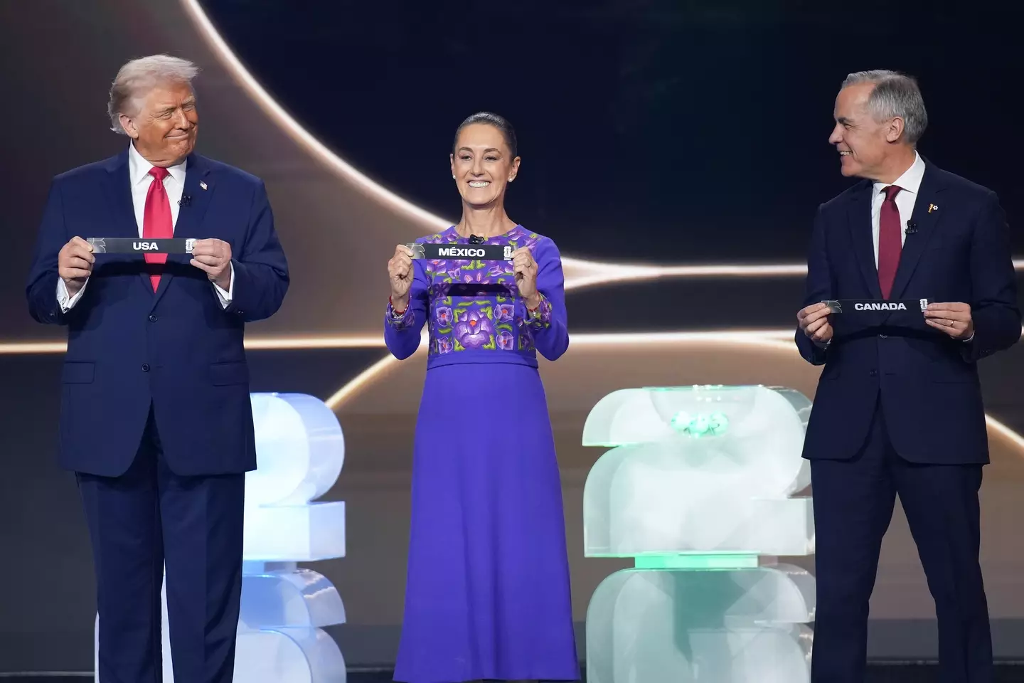 The three world leaders appeared united at the FIFA World Cup draw (Andrew Harnik/Getty Images)