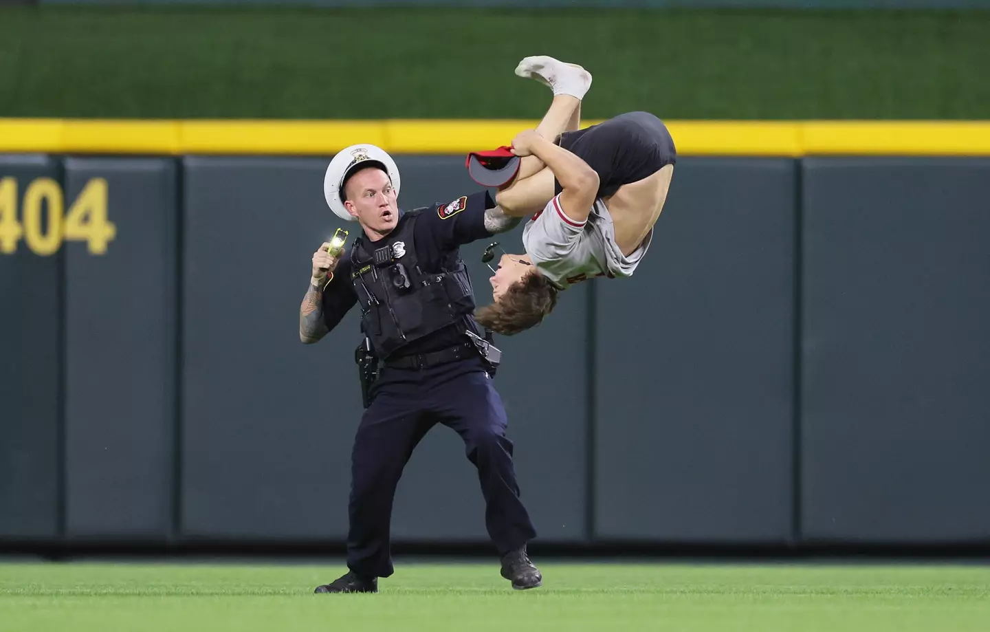 The streaker performed a flip on the field of play. (Andy Lyons/Staff)
