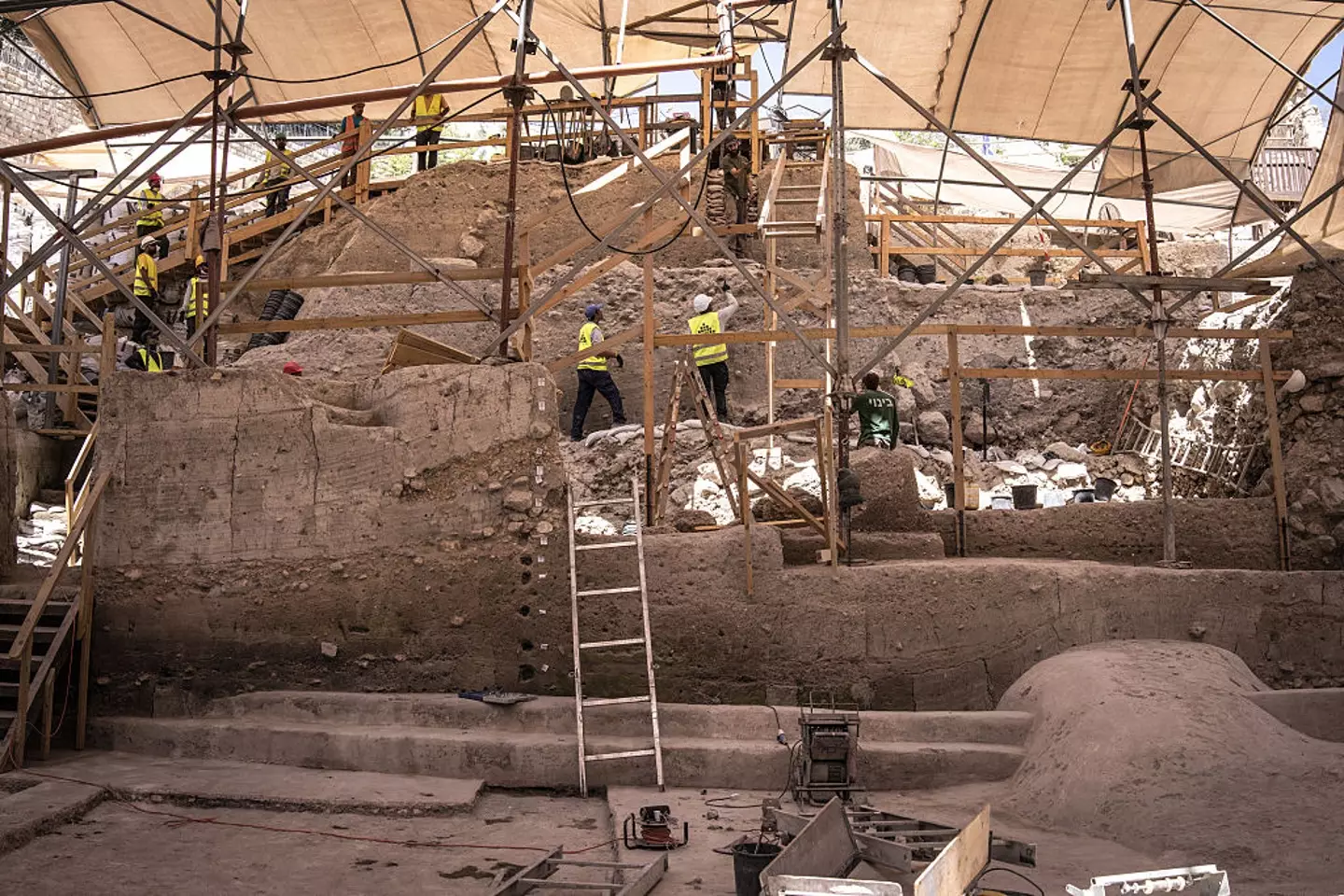 Workers for the Israeli antiquities authority excavate a newly uncovered dam in the city of David national Park in Jerusalem on August 26, 2025 (JOHN WESSELS/AFP via Getty Images)