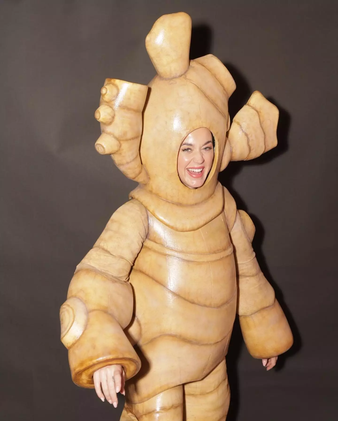 Katy Perry is all smiles dressed as a ginger root.