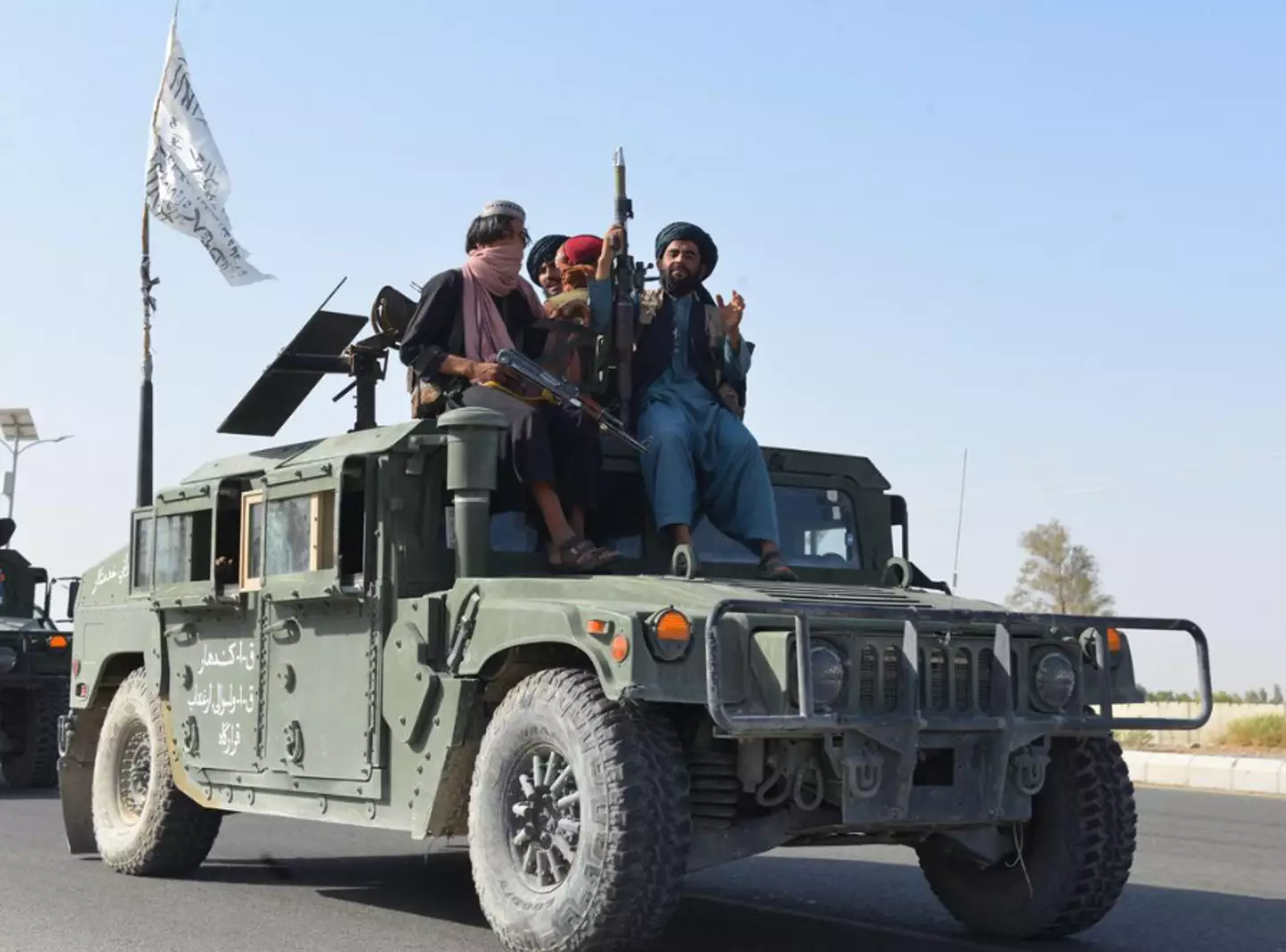 Soldiers are stationed by the cliffs where the Buddhas once stood.