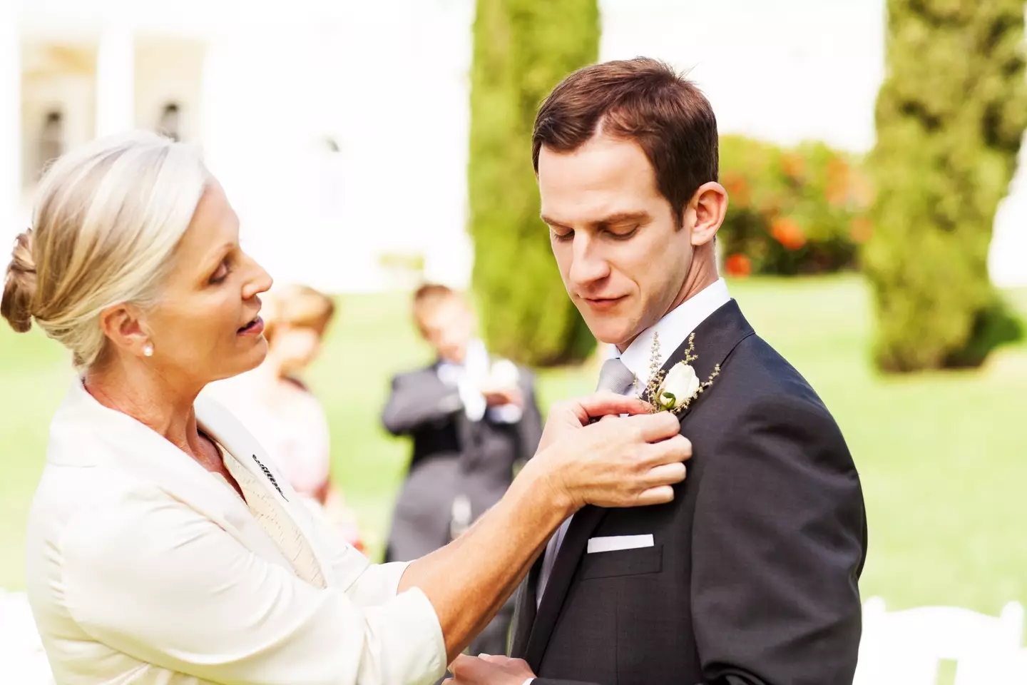 The groom was spotted having a weirdly intimate moment with his mom (Getty Stock)
