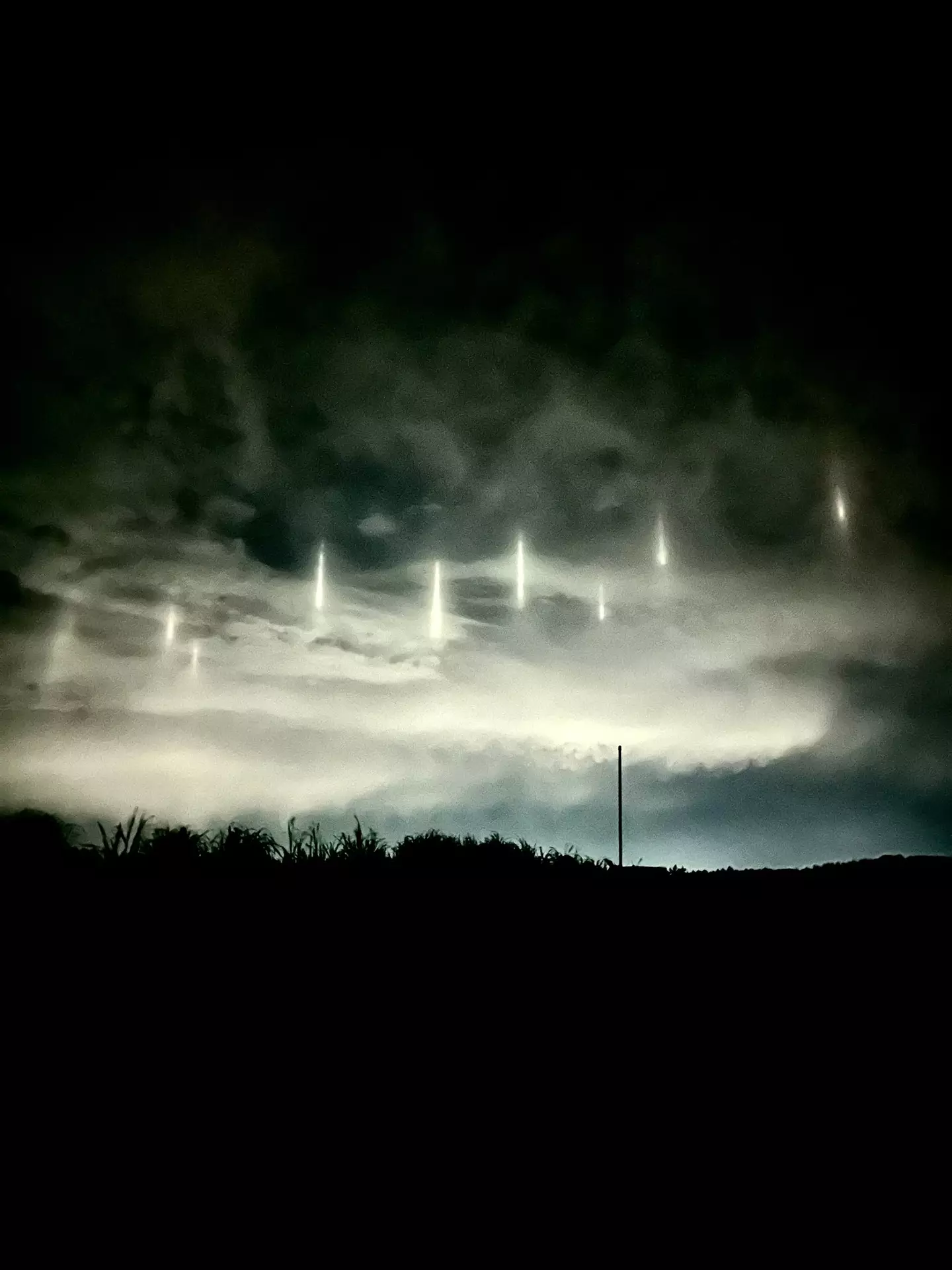 Nine light pillars light up parts of Japan's skies earlier this month. (@maashii_taiyo/X)