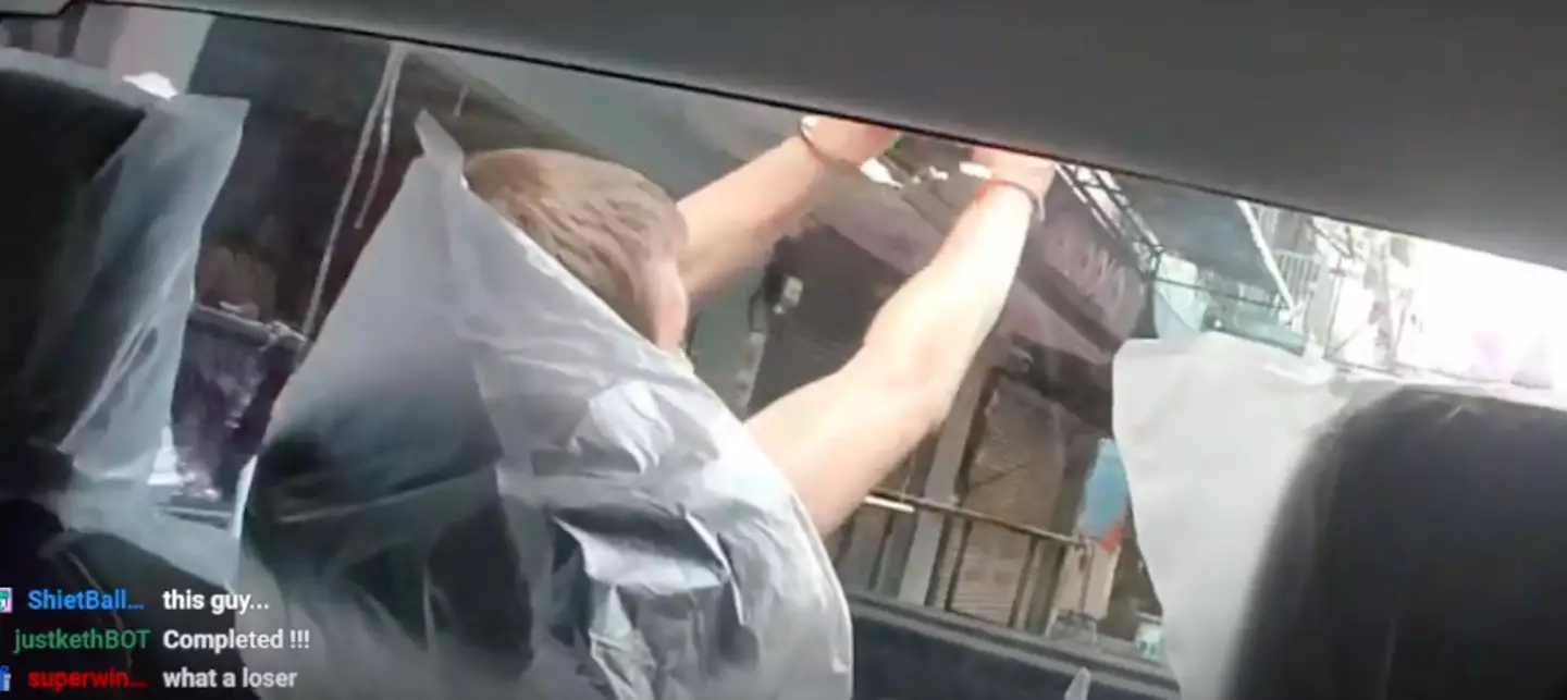 The man could be seen in handcuffs in the back of the police van.