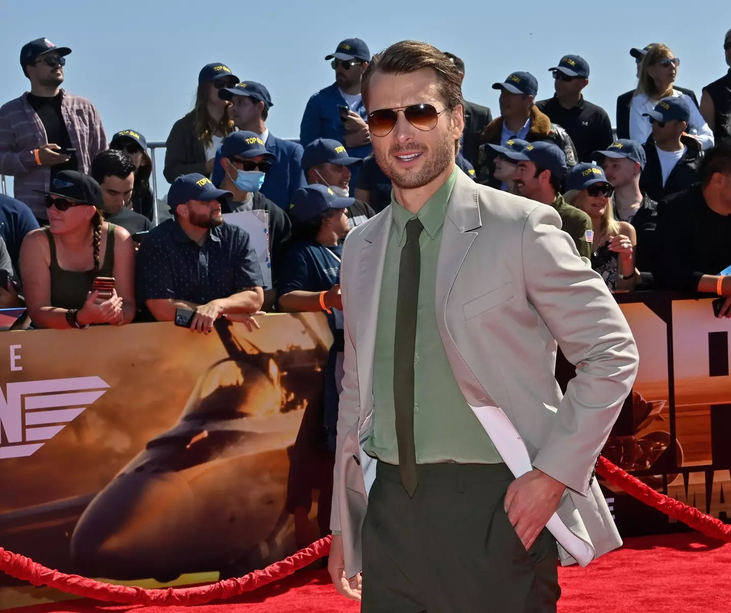 Glen Powell was challenged to go skydiving by Tom Cruise.