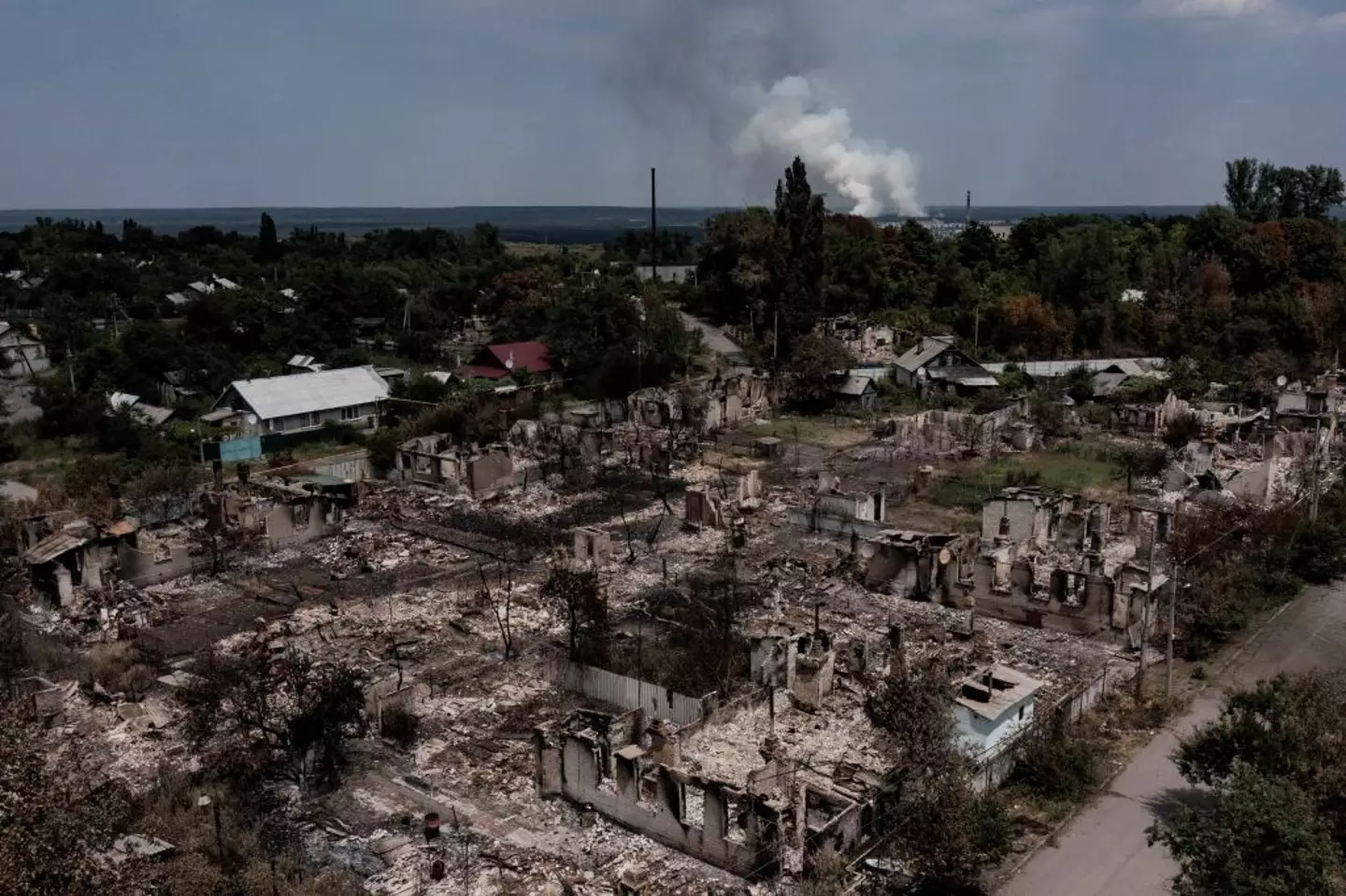 An aerial view shows destroyed houses in the town of Pryvillya in the eastern Ukrainian region of Donbas (ARIS MESSINIS/AFP via Getty Images)