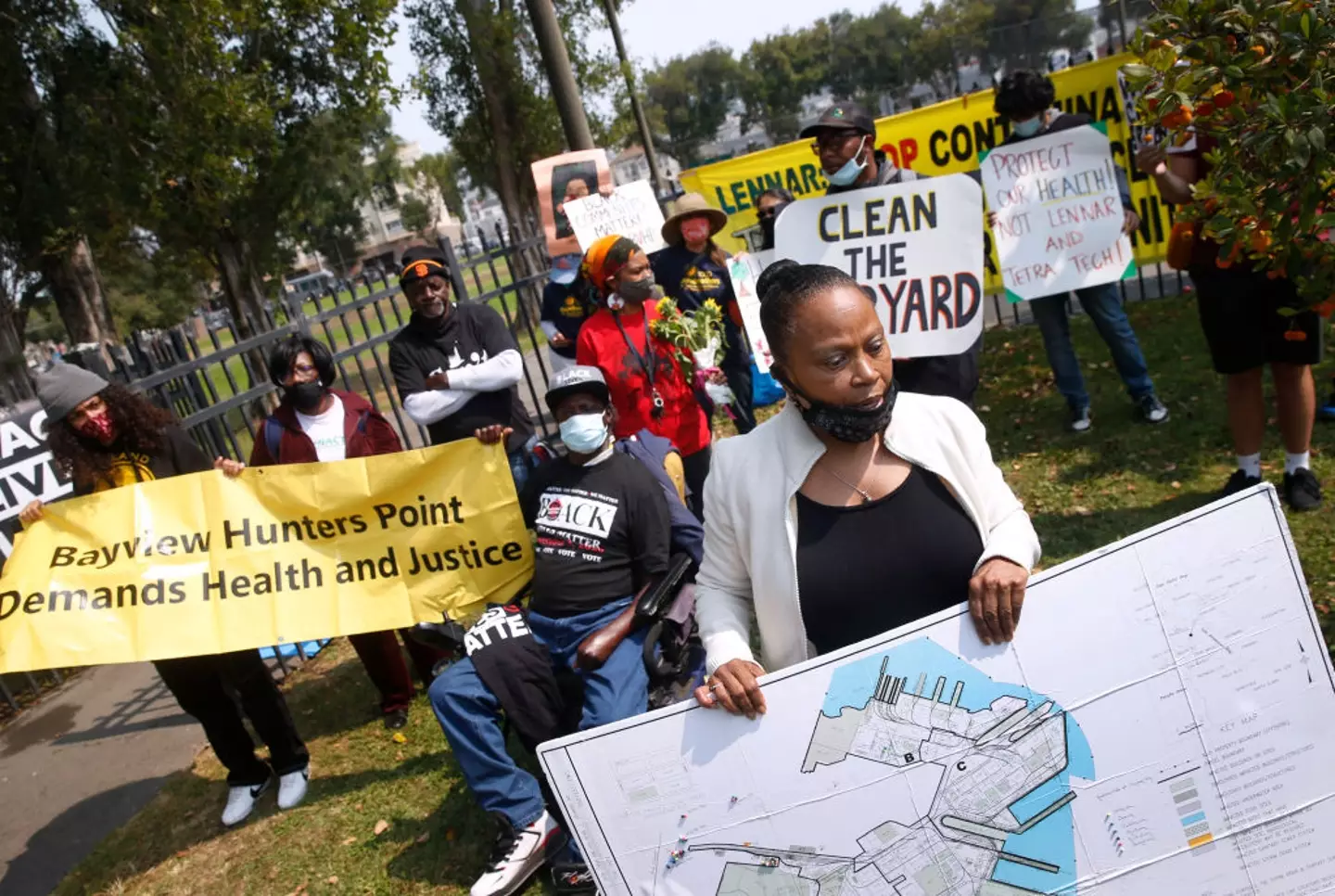 Dr Ahimsa Porter Sumchai identifies toxic sites on a map of Hunters Point at a rally by residents and community activists in San Francisco, back in 2020 (Paul Chinn/The San Francisco Chronicle via Getty Images)