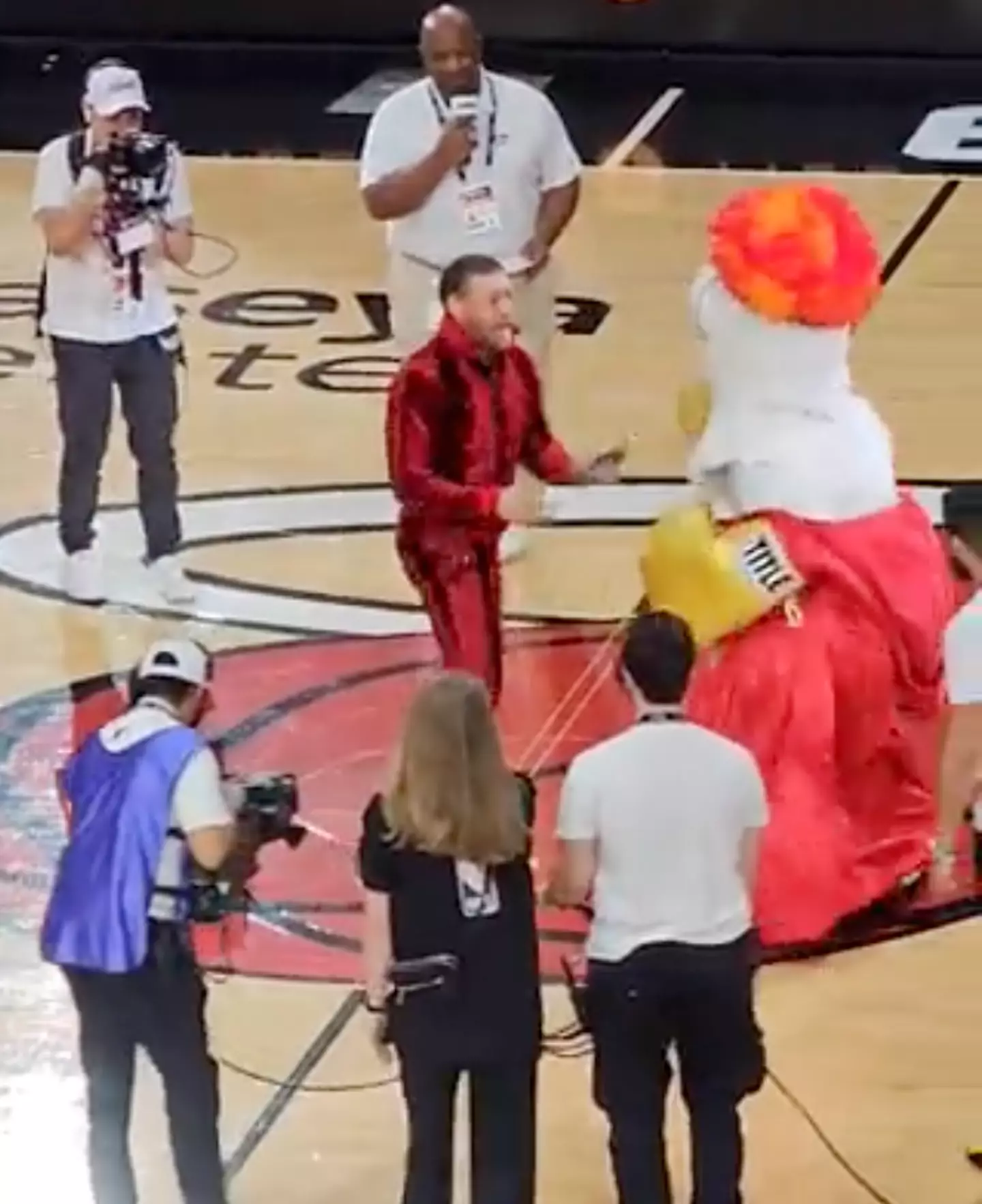 Conor McGregor face to face with Burnie the mascot.