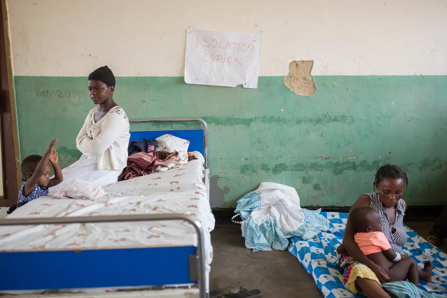 Mothers and children sit in the isolation ward in Bundibugyo Hospital, Uganda.