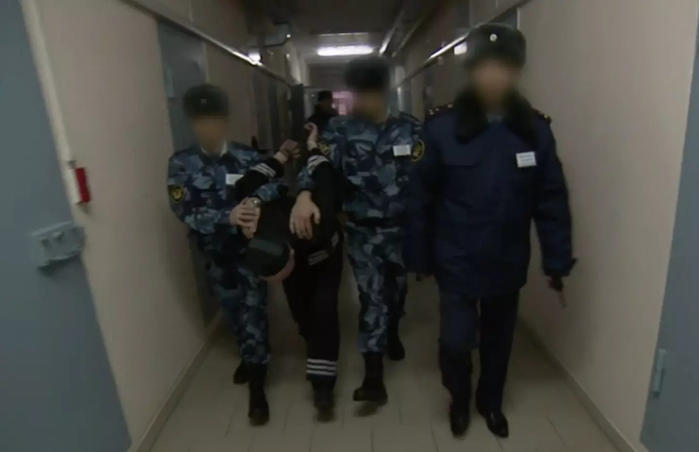 Prisoners at Black Dolphin are bent over to limit their view of the prison and prevent them from attacking.