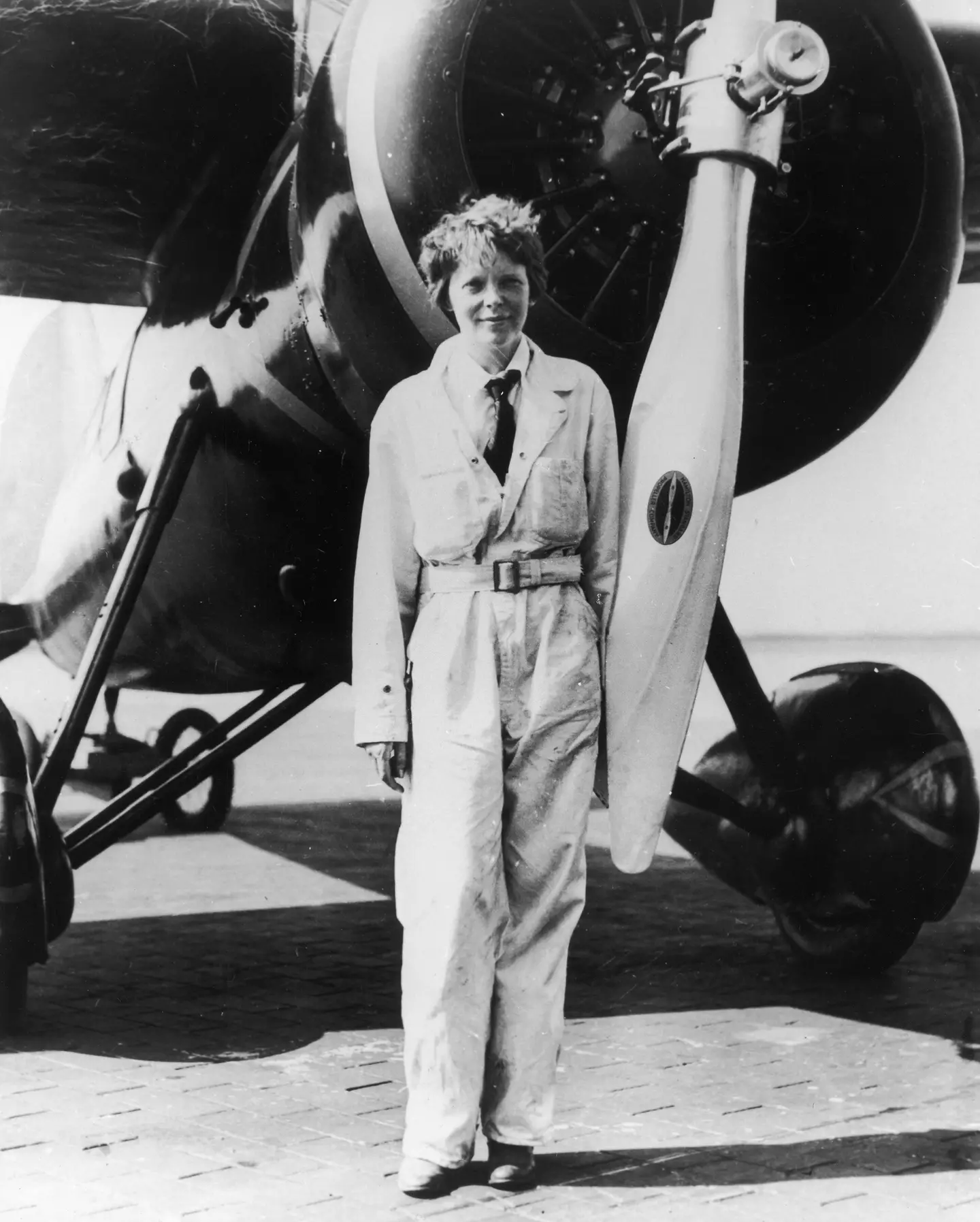 Earhart in front of her Electra plane (Photo by Fotosearch/Getty Images)