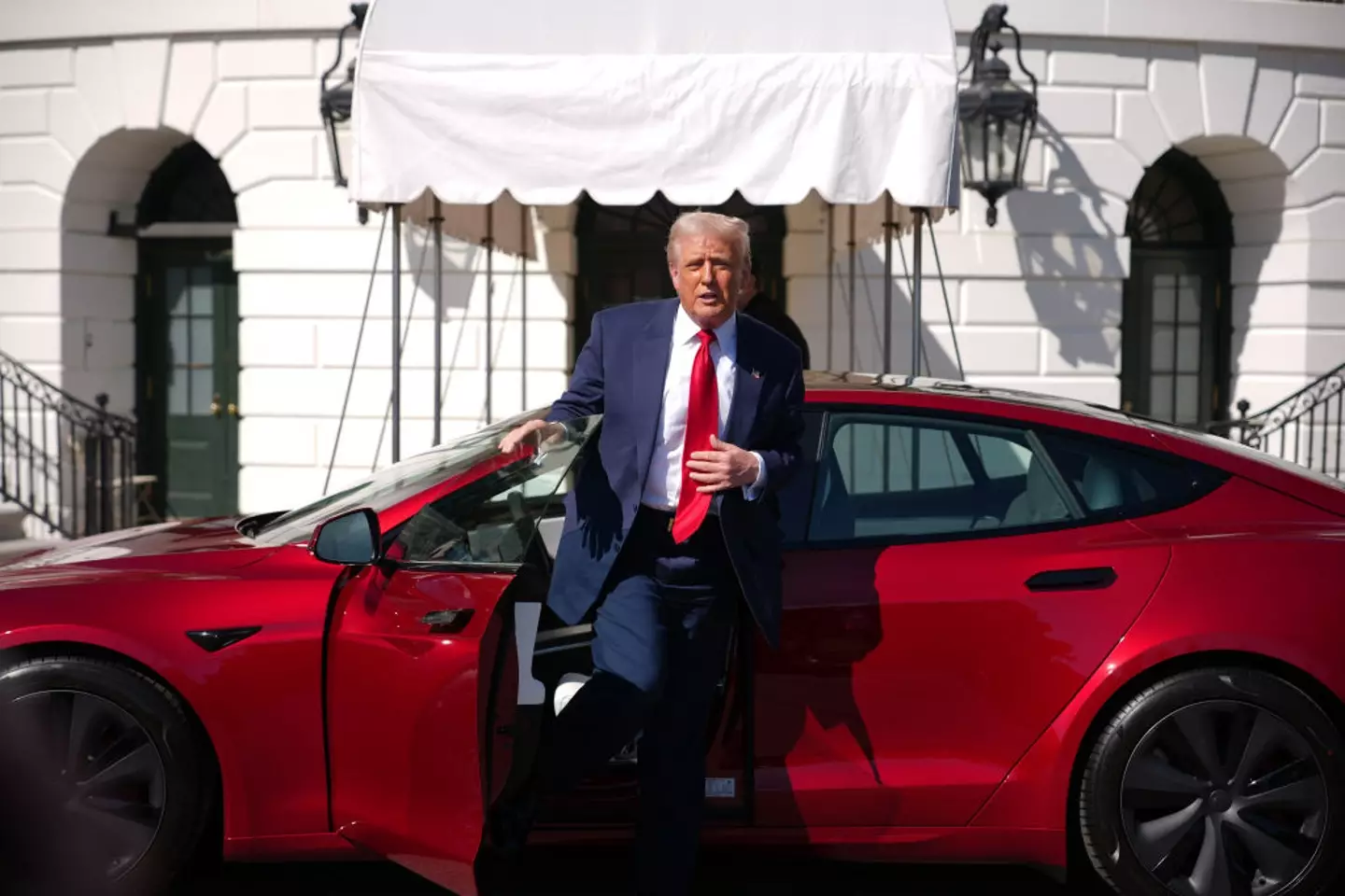 Donald Trump gets out of a Tesla Model S on the South Lawn of the White House (Andrew Harnik/Getty Images)