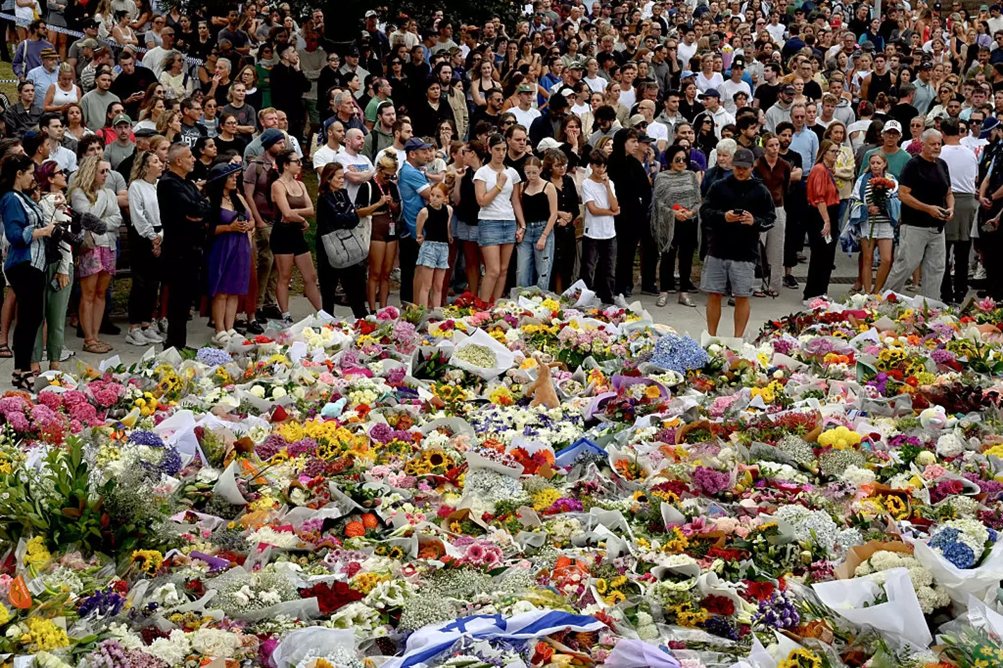 Tributes have been made at Sydney's Bondi Beach, where 15 people lost their lives in a mass shooting on Sunday (Saeed KHAN / AFP via Getty Images)